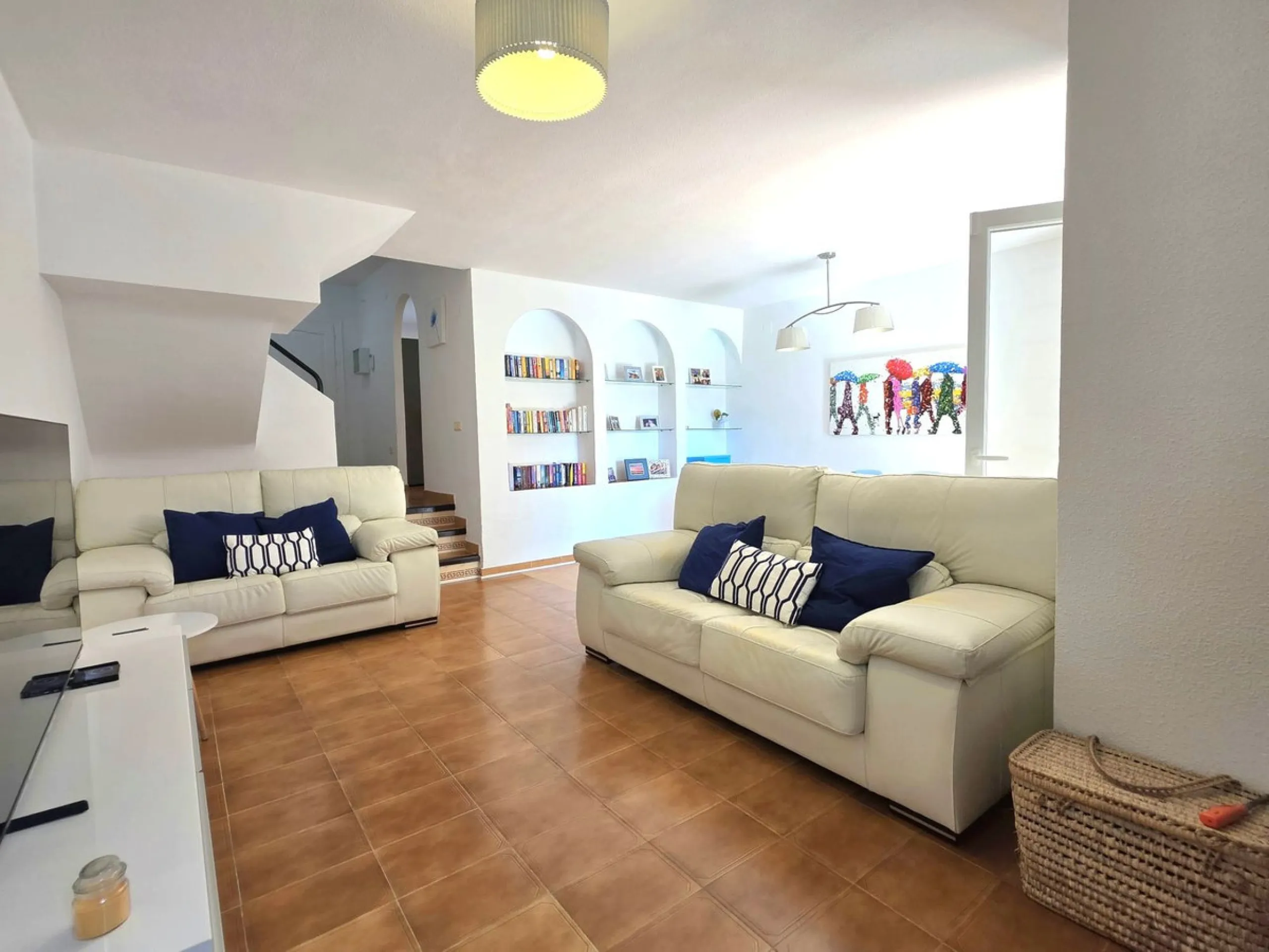 This beautiful 3 bed townhouse is located in a fantastic area, walking distance to all amenities and the beach. The house is Andalucian in style, built over 3 levels and sold fully furnished. On the ground level you are greeted by an entrance hall and lar