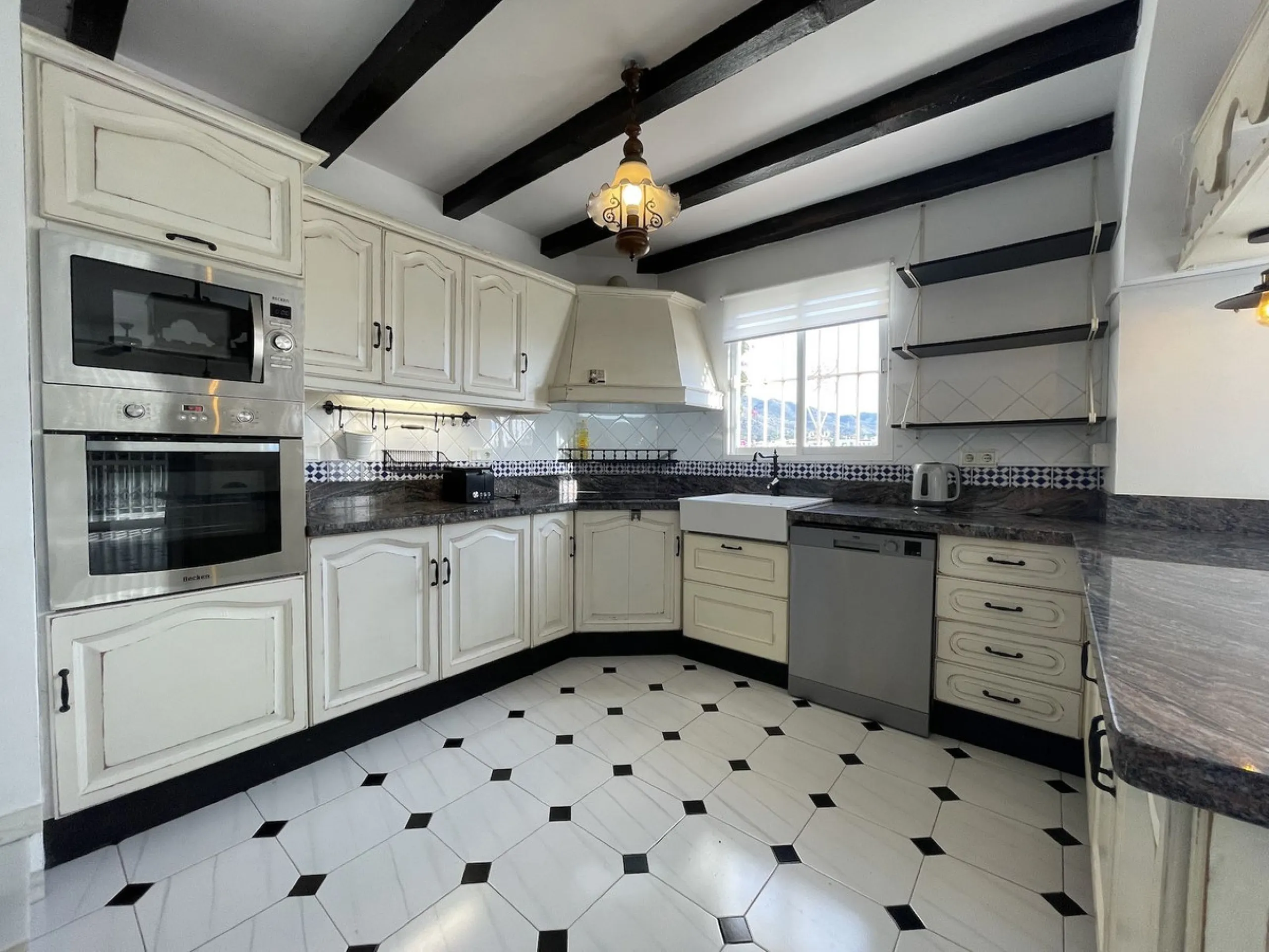 Lovely four bedroom, three bathroom villa built over three floors. Upon entering the main house, there is a spacious open plan kitchen and living room with fireplace, with a separate WC, an East facing balcony and a South facing terrace. The stairs lead t
