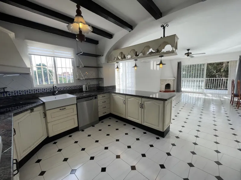 Lovely four bedroom, three bathroom villa built over three floors. Upon entering the main house, there is a spacious open plan kitchen and living room with fireplace, with a separate WC, an East facing balcony and a South facing terrace. The stairs lead t