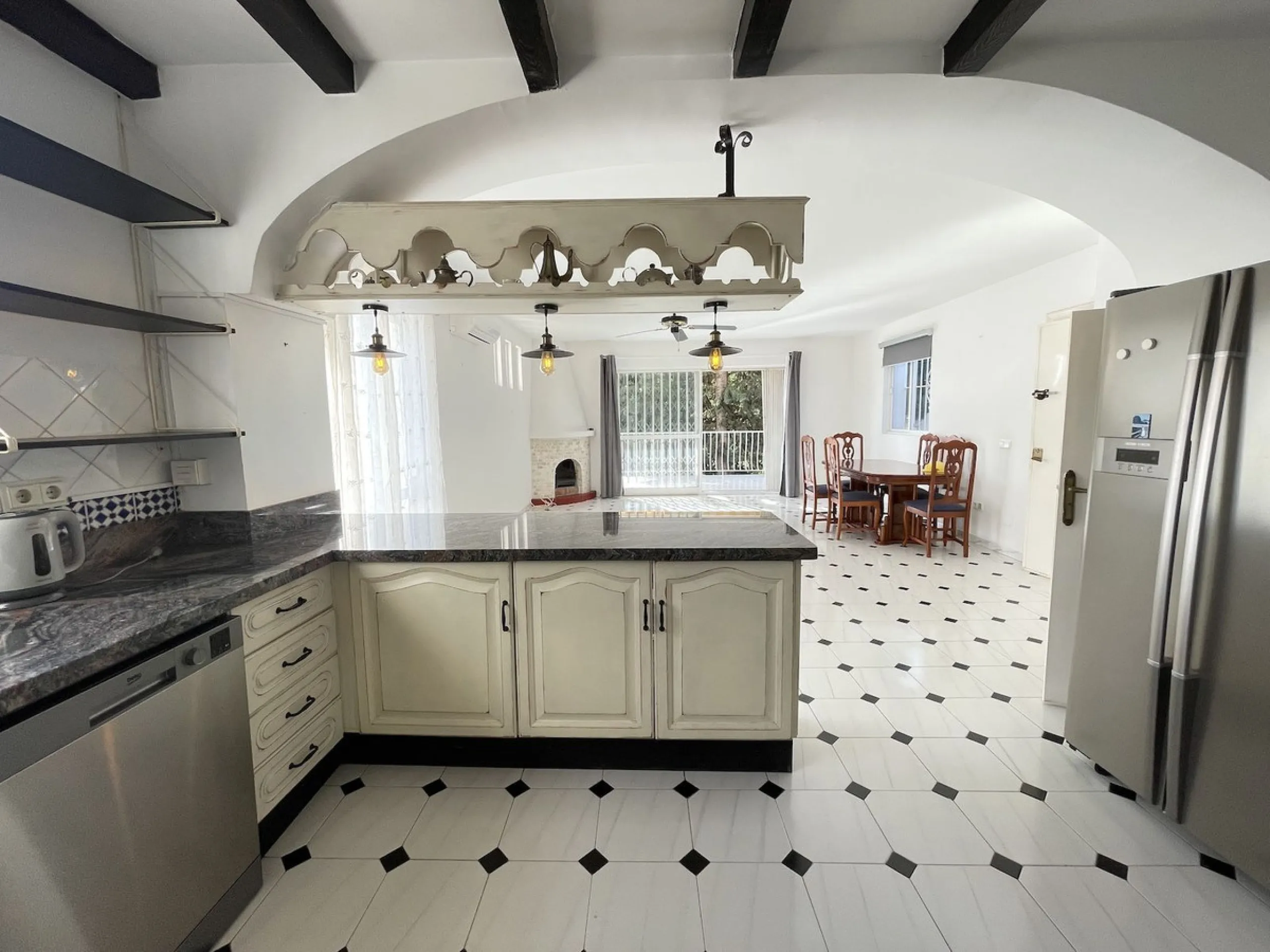 Lovely four bedroom, three bathroom villa built over three floors. Upon entering the main house, there is a spacious open plan kitchen and living room with fireplace, with a separate WC, an East facing balcony and a South facing terrace. The stairs lead t