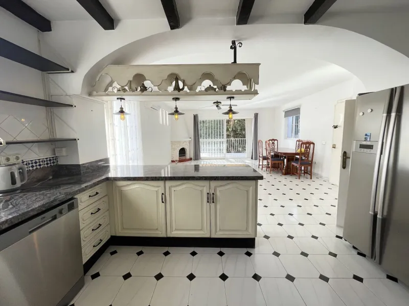 Lovely four bedroom, three bathroom villa built over three floors. Upon entering the main house, there is a spacious open plan kitchen and living room with fireplace, with a separate WC, an East facing balcony and a South facing terrace. The stairs lead t