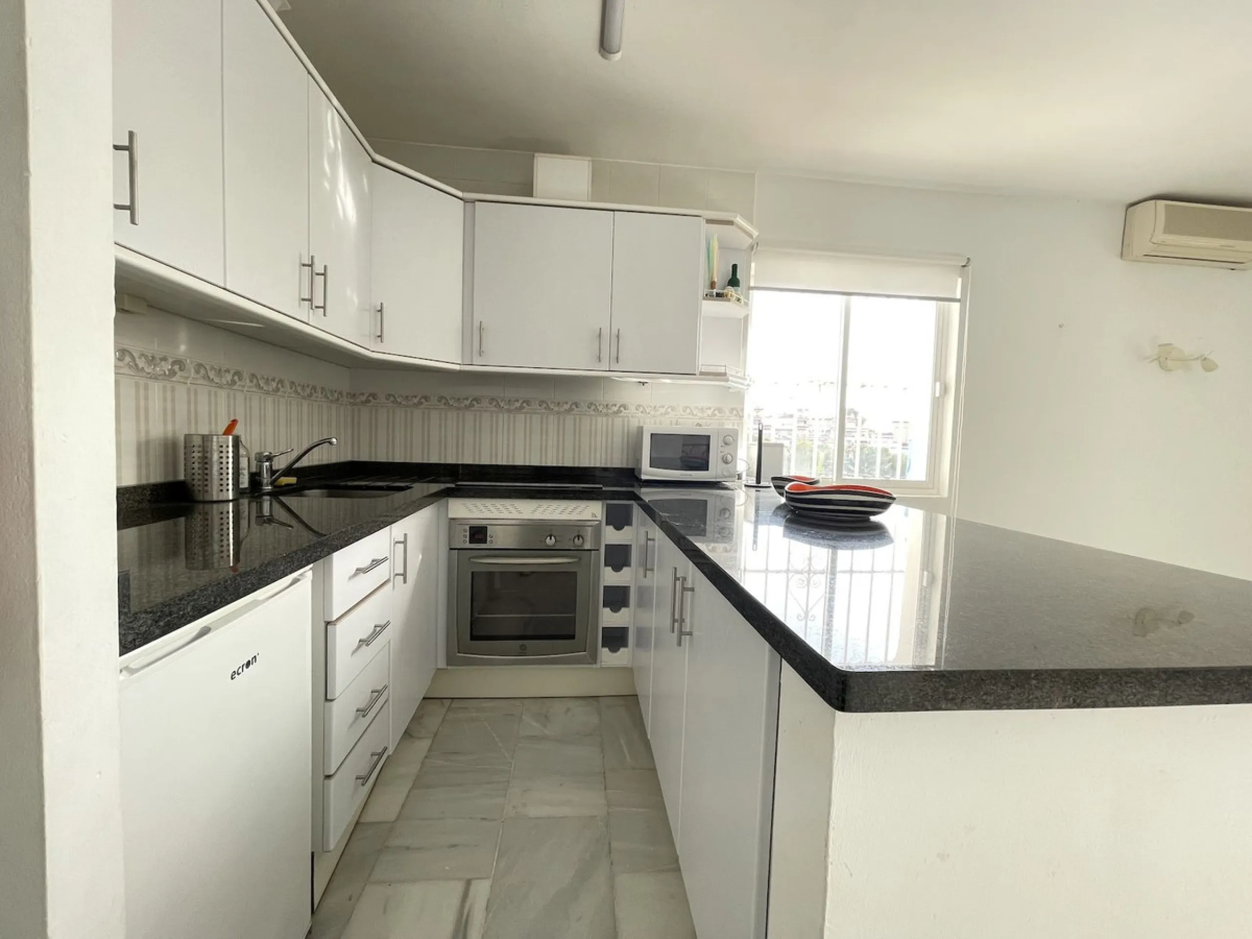 Lovely four bedroom, three bathroom villa built over three floors. Upon entering the main house, there is a spacious open plan kitchen and living room with fireplace, with a separate WC, an East facing balcony and a South facing terrace. The stairs lead t
