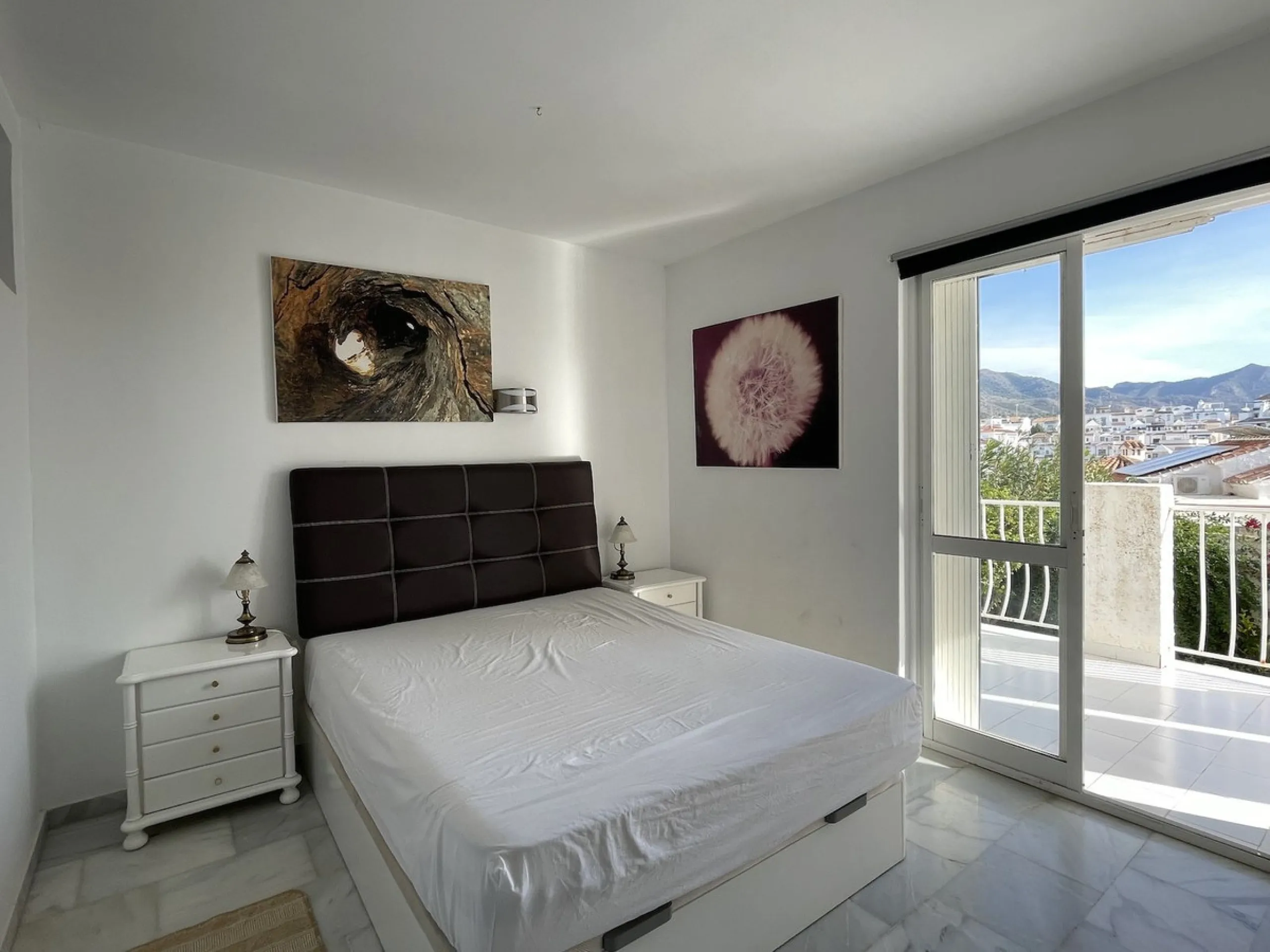 Lovely four bedroom, three bathroom villa built over three floors. Upon entering the main house, there is a spacious open plan kitchen and living room with fireplace, with a separate WC, an East facing balcony and a South facing terrace. The stairs lead t