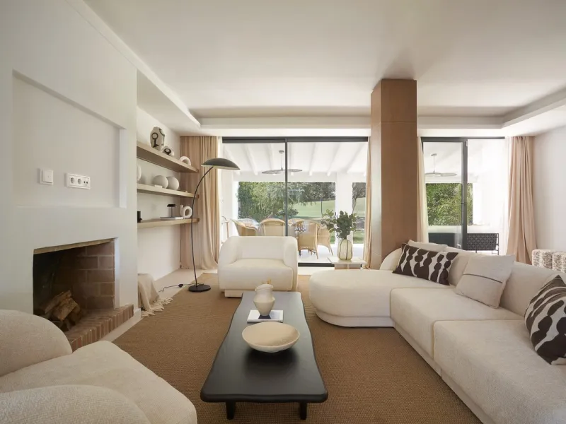 Frontline Aloha Golf townhouse nestled in the prestigious Golf Valley of Nueva Andalucía, this beautifully designed three-story townhouse offers a seamless blend of Mediterranean charm and modern living. Recently renovated, the property captures the lifes