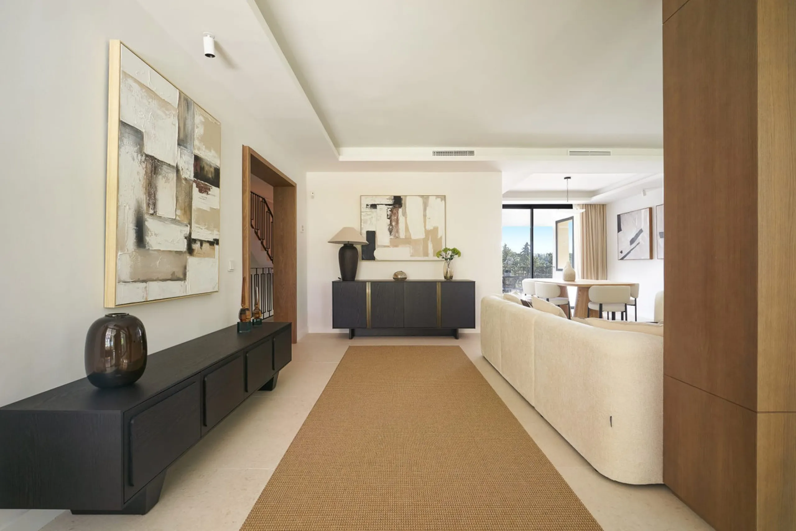 Frontline Aloha Golf townhouse nestled in the prestigious Golf Valley of Nueva Andalucía, this beautifully designed three-story townhouse offers a seamless blend of Mediterranean charm and modern living. Recently renovated, the property captures the lifes