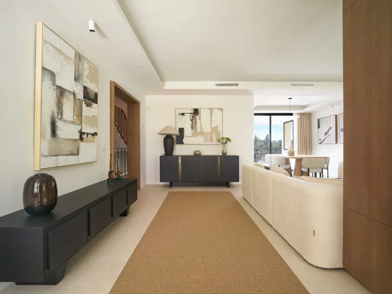 Frontline Aloha Golf townhouse nestled in the prestigious Golf Valley of Nueva Andalucía, this beautifully designed three-story townhouse offers a seamless blend of Mediterranean charm and modern living. Recently renovated, the property captures the lifes