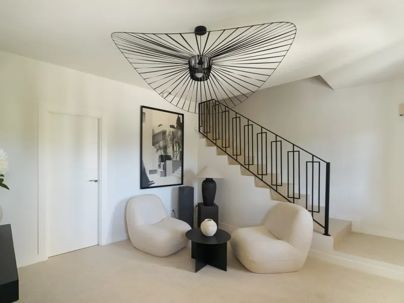 Frontline Aloha Golf townhouse nestled in the prestigious Golf Valley of Nueva Andalucía, this beautifully designed three-story townhouse offers a seamless blend of Mediterranean charm and modern living. Recently renovated, the property captures the lifes