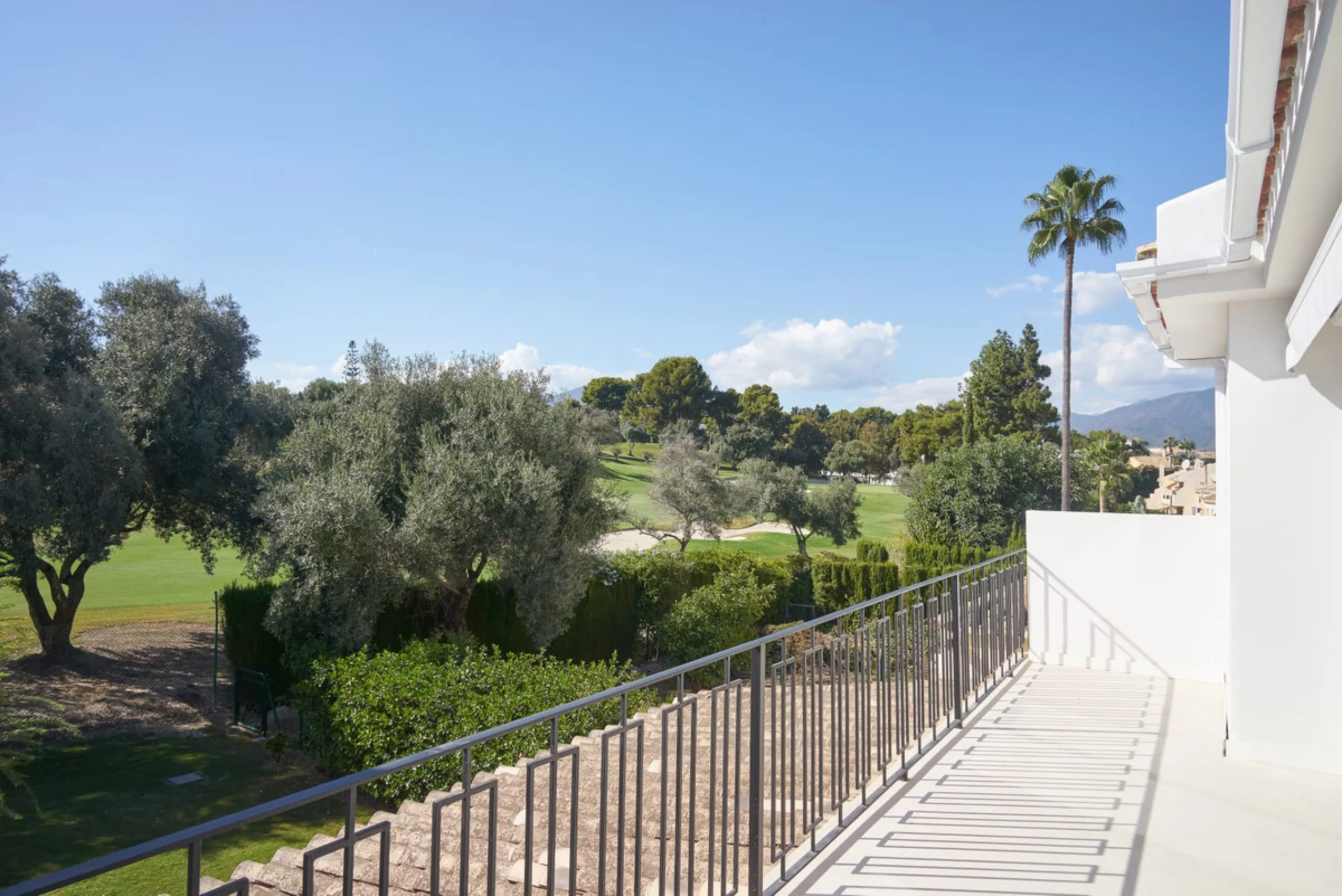 Frontline Aloha Golf townhouse nestled in the prestigious Golf Valley of Nueva Andalucía, this beautifully designed three-story townhouse offers a seamless blend of Mediterranean charm and modern living. Recently renovated, the property captures the lifes