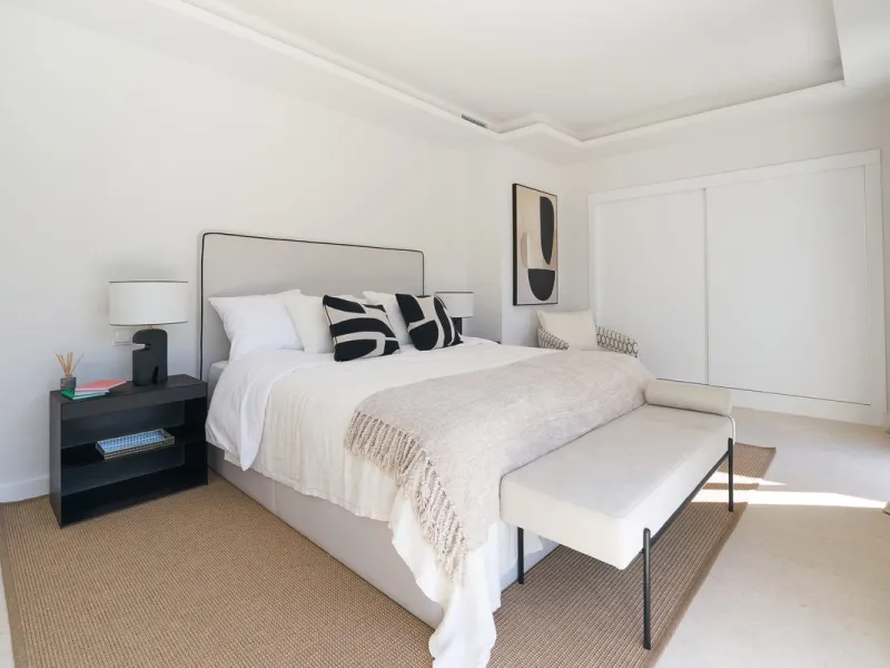 Frontline Aloha Golf townhouse nestled in the prestigious Golf Valley of Nueva Andalucía, this beautifully designed three-story townhouse offers a seamless blend of Mediterranean charm and modern living. Recently renovated, the property captures the lifes