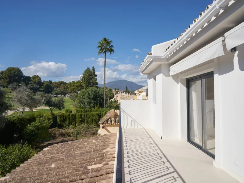 Frontline Aloha Golf townhouse nestled in the prestigious Golf Valley of Nueva Andalucía, this beautifully designed three-story townhouse offers a seamless blend of Mediterranean charm and modern living. Recently renovated, the property captures the lifes