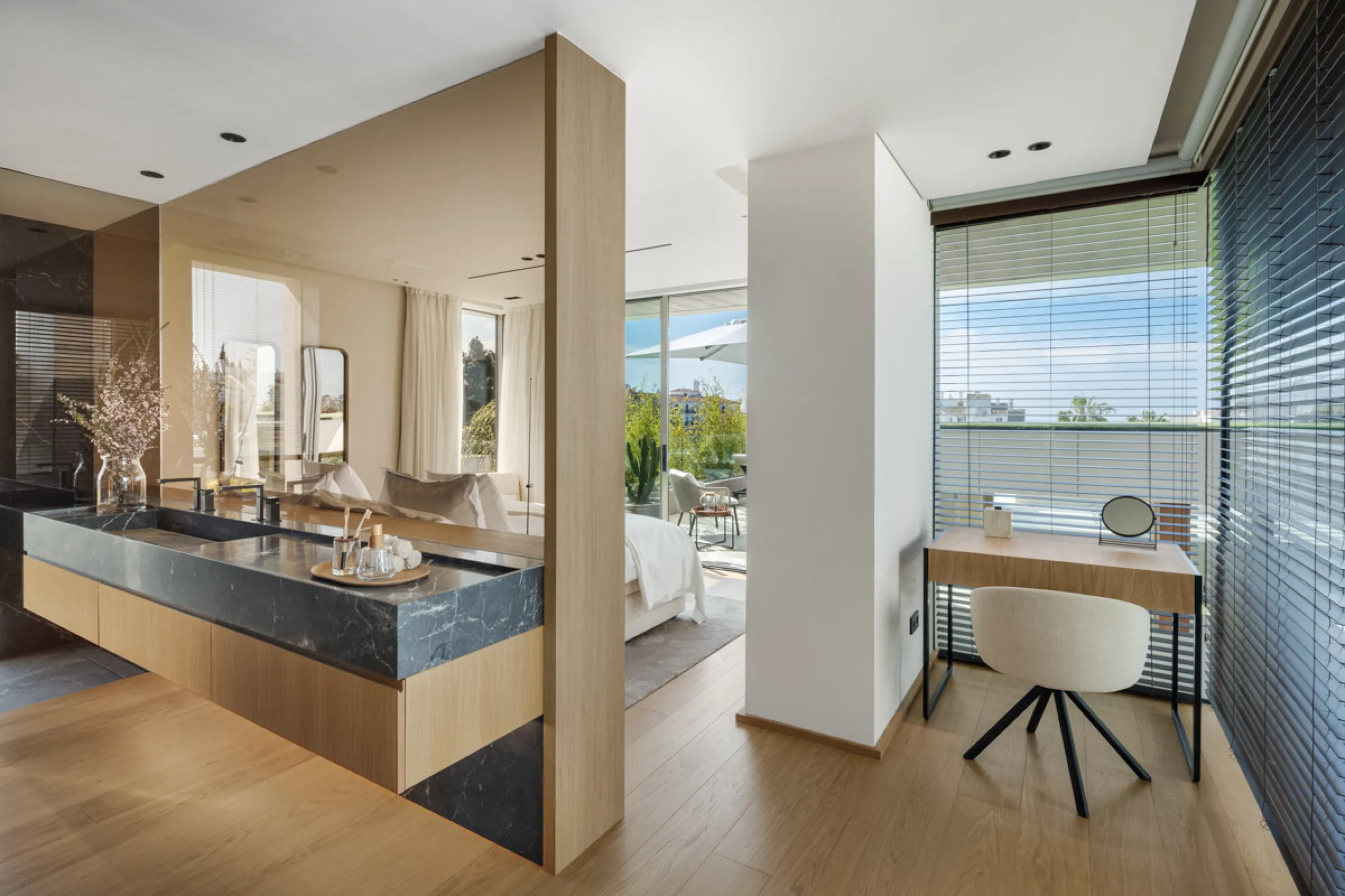 Nestled gracefully upon the verdant slopes of Nueva Andalucía, this villa is a triumph of modern elegance and luxurious design, an embodiment of serene sophistication. As you approach the property, you are greeted by a grand entrance framed by sleek lines