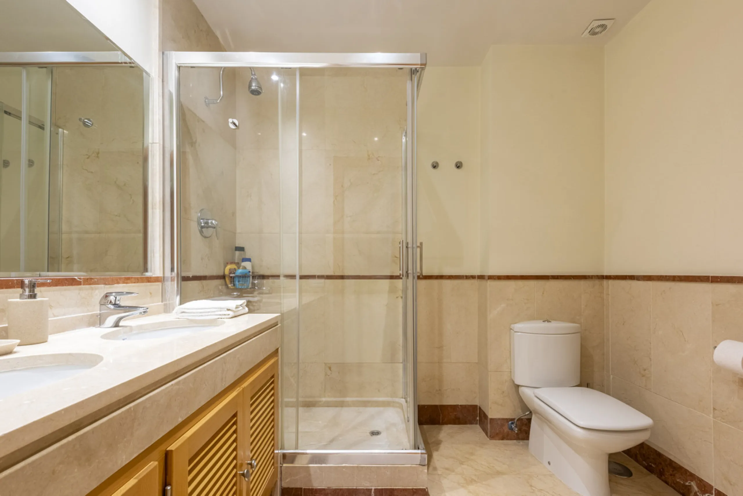 This modern and inviting two-bedroom apartment, nestled within the exclusive Las Mimosas complex, offers a truly exceptional living experience.