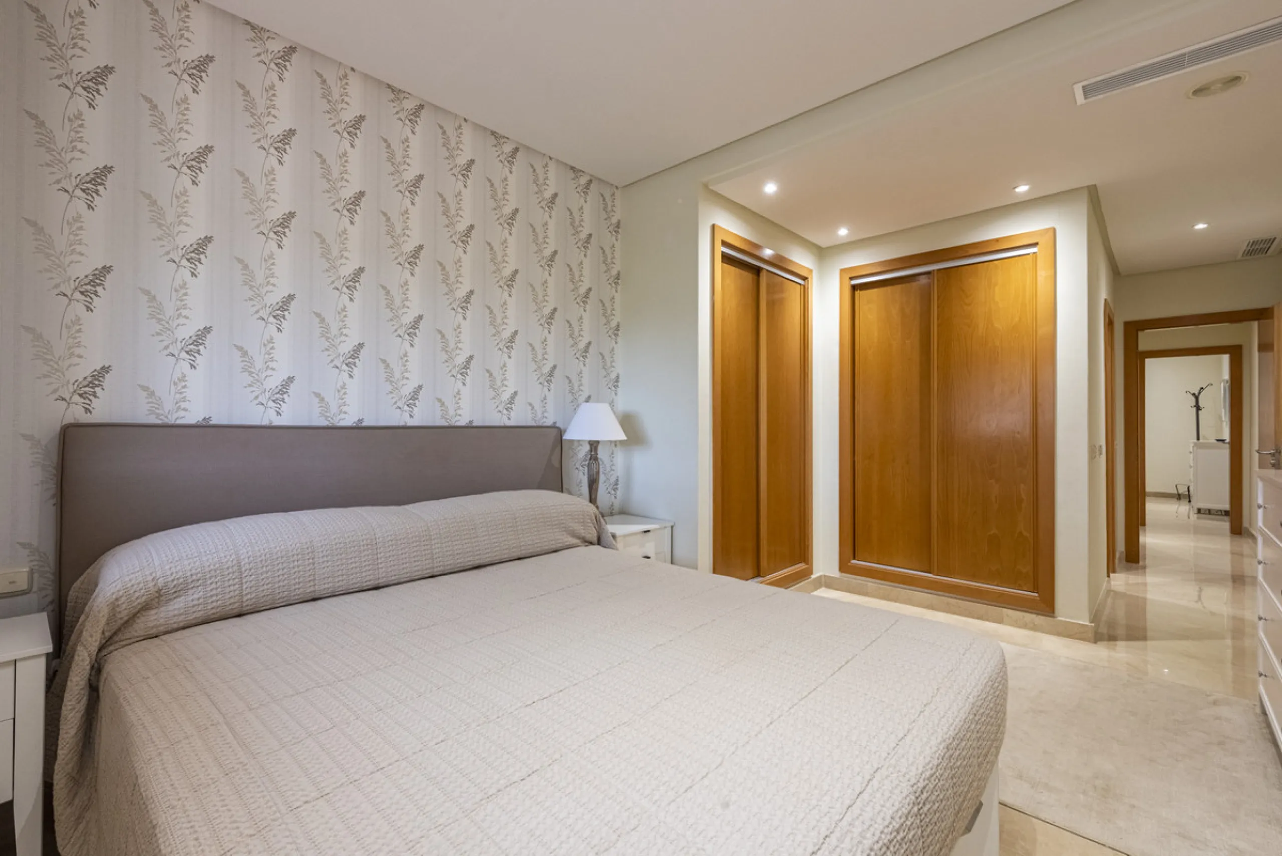 This modern and inviting two-bedroom apartment, nestled within the exclusive Las Mimosas complex, offers a truly exceptional living experience.