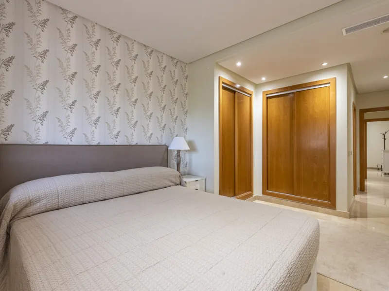 This modern and inviting two-bedroom apartment, nestled within the exclusive Las Mimosas complex, offers a truly exceptional living experience.