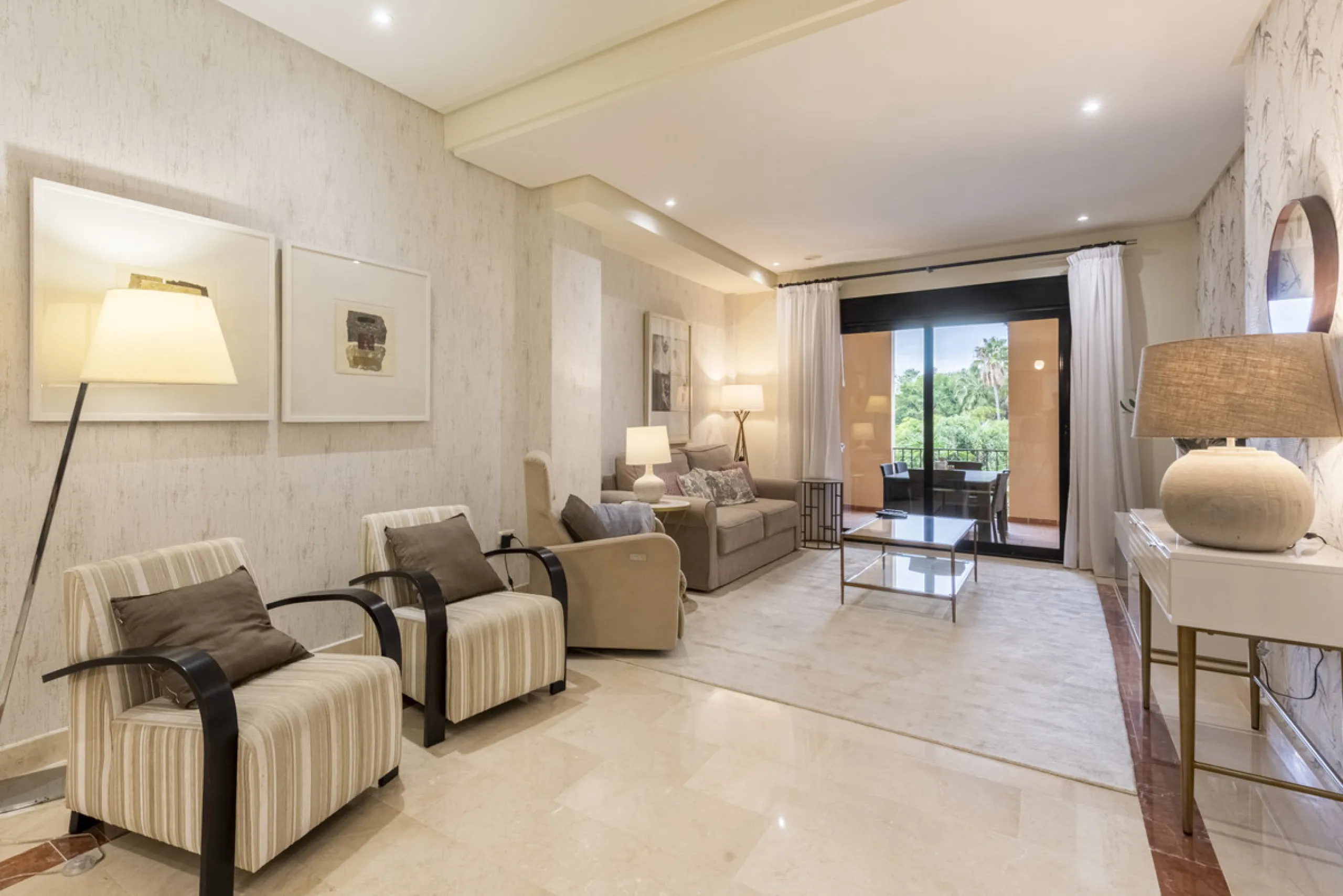 This modern and inviting two-bedroom apartment, nestled within the exclusive Las Mimosas complex, offers a truly exceptional living experience.