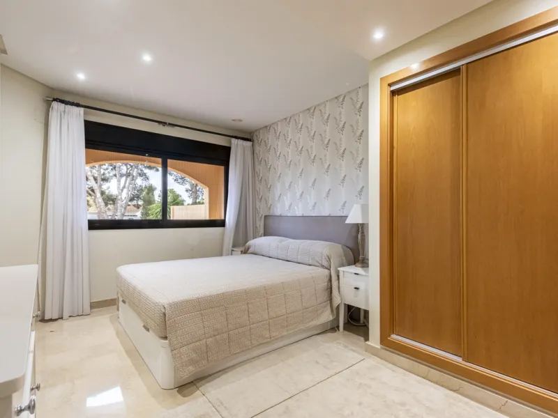 This modern and inviting two-bedroom apartment, nestled within the exclusive Las Mimosas complex, offers a truly exceptional living experience.