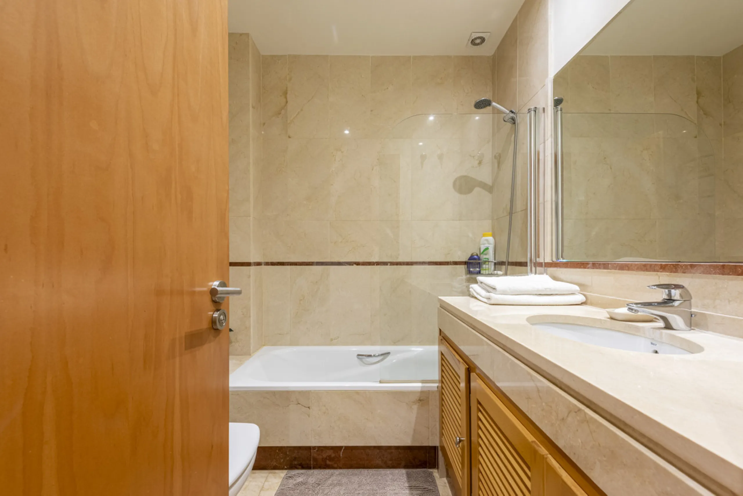 This modern and inviting two-bedroom apartment, nestled within the exclusive Las Mimosas complex, offers a truly exceptional living experience.