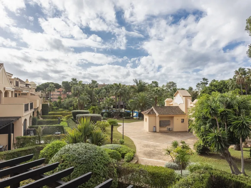 This modern and inviting two-bedroom apartment, nestled within the exclusive Las Mimosas complex, offers a truly exceptional living experience.