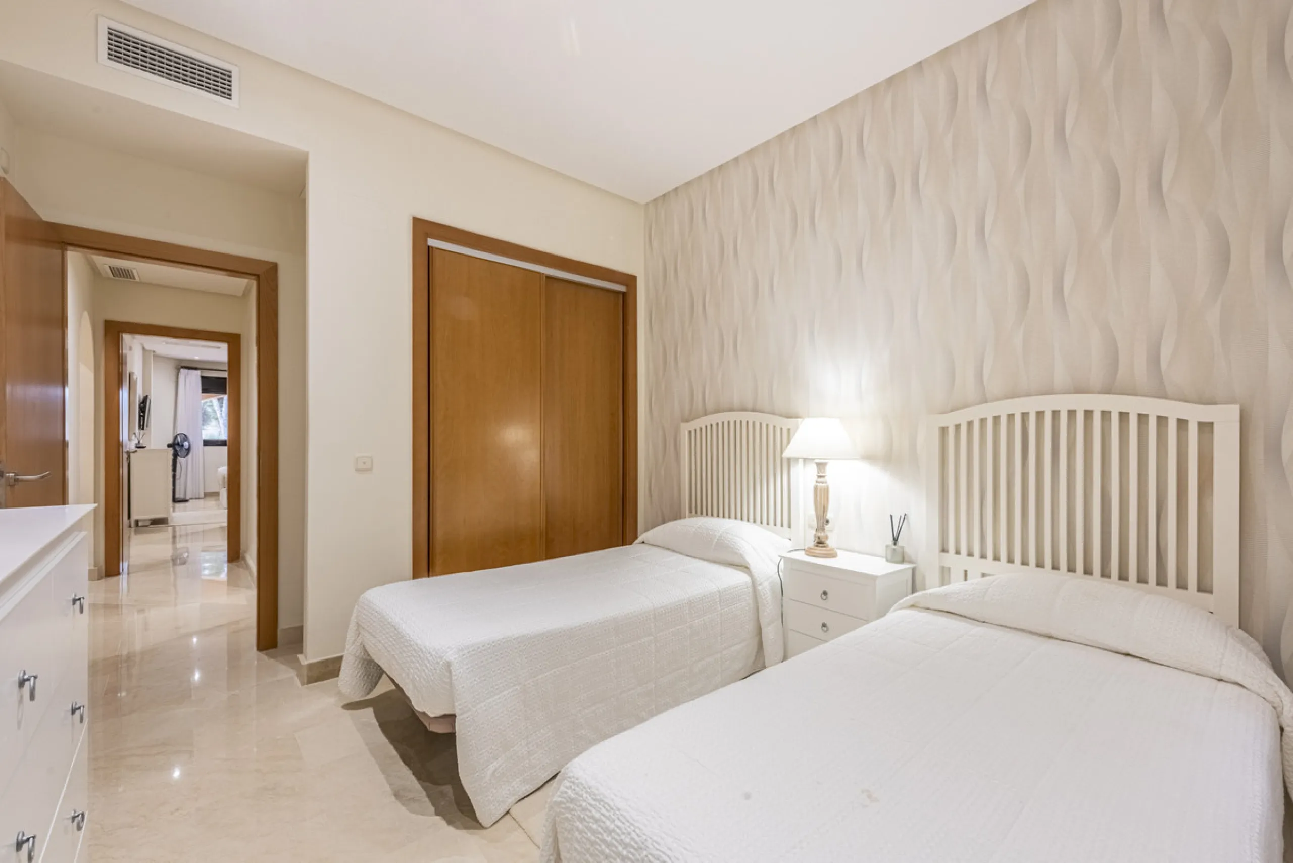 This modern and inviting two-bedroom apartment, nestled within the exclusive Las Mimosas complex, offers a truly exceptional living experience.