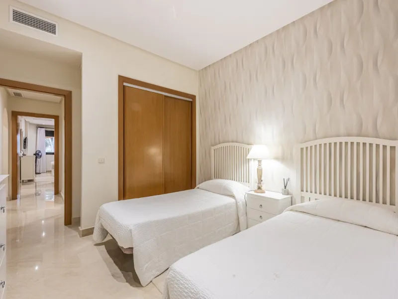 This modern and inviting two-bedroom apartment, nestled within the exclusive Las Mimosas complex, offers a truly exceptional living experience.