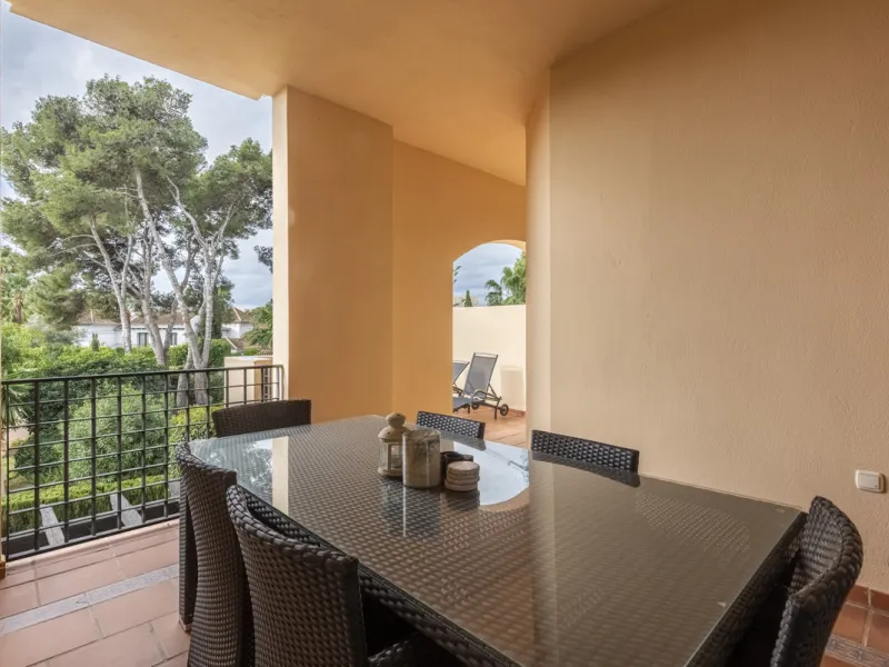 This modern and inviting two-bedroom apartment, nestled within the exclusive Las Mimosas complex, offers a truly exceptional living experience.