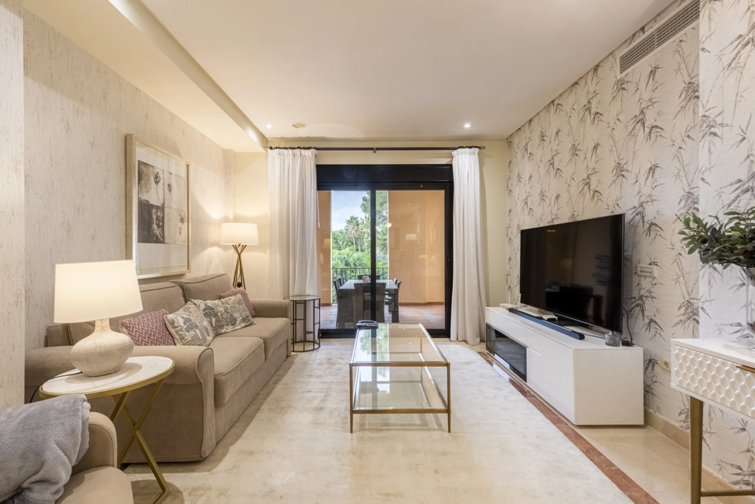 This modern and inviting two-bedroom apartment, nestled within the exclusive Las Mimosas complex, offers a truly exceptional living experience.