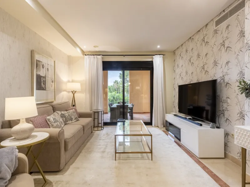This modern and inviting two-bedroom apartment, nestled within the exclusive Las Mimosas complex, offers a truly exceptional living experience.