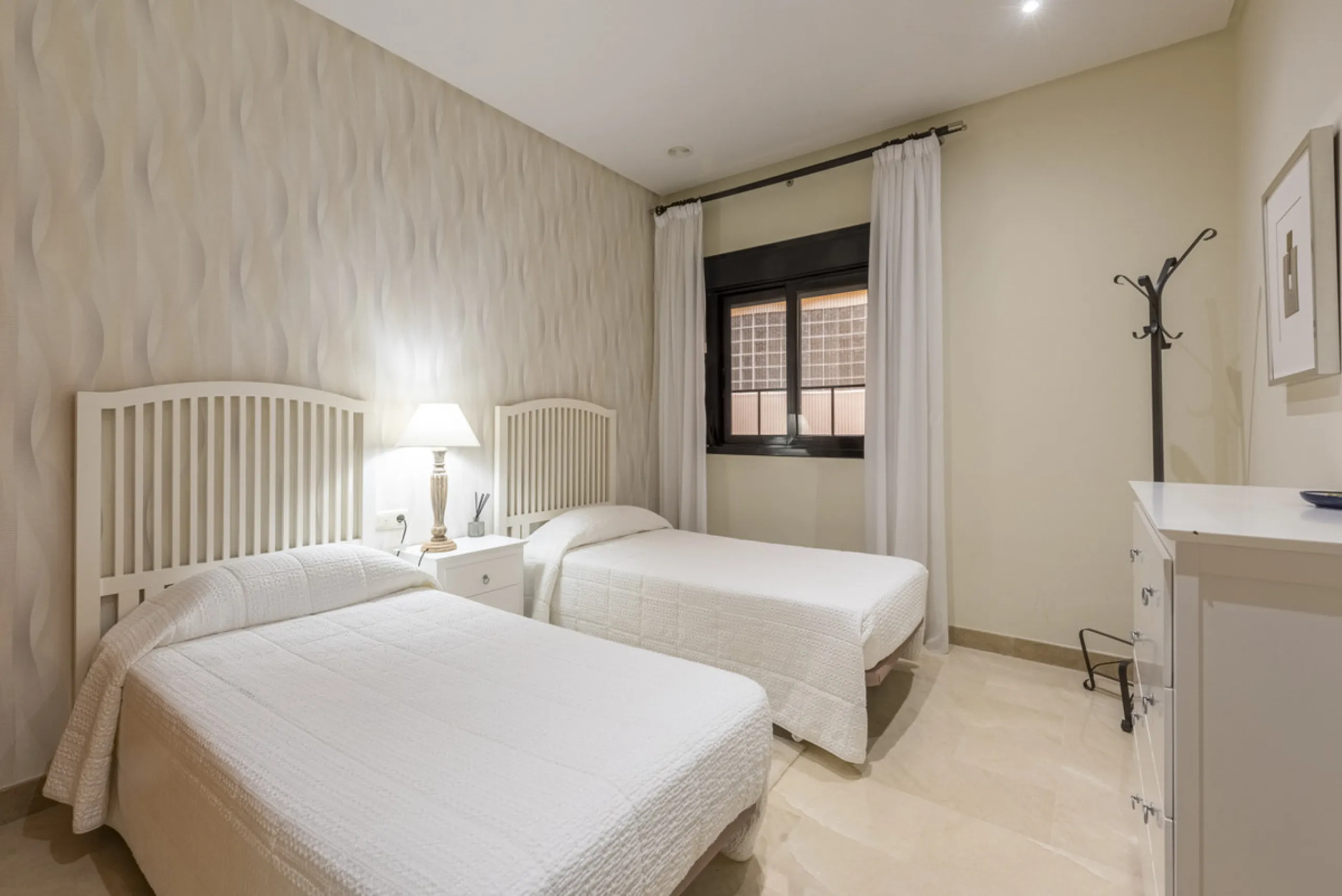 This modern and inviting two-bedroom apartment, nestled within the exclusive Las Mimosas complex, offers a truly exceptional living experience.