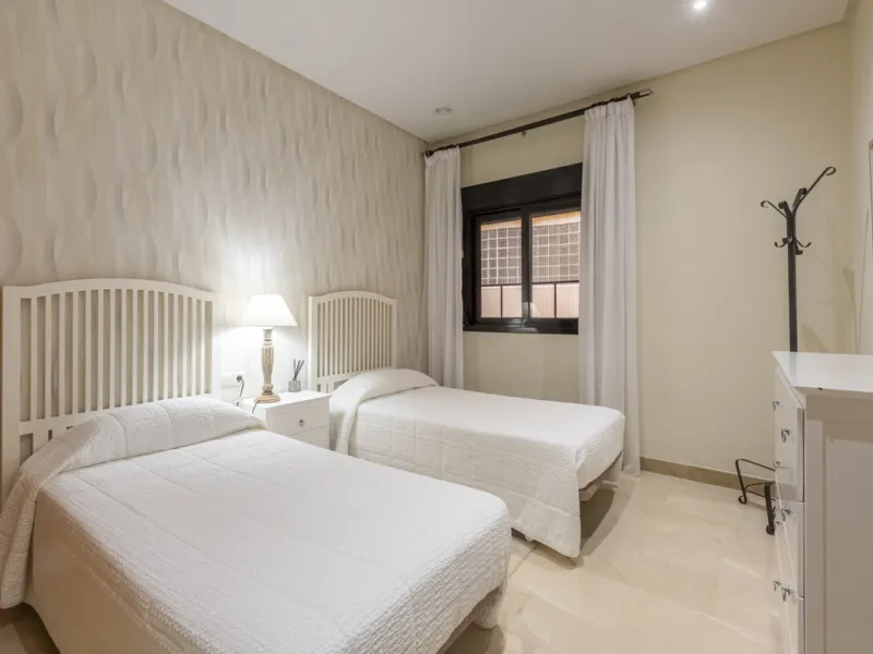 This modern and inviting two-bedroom apartment, nestled within the exclusive Las Mimosas complex, offers a truly exceptional living experience.