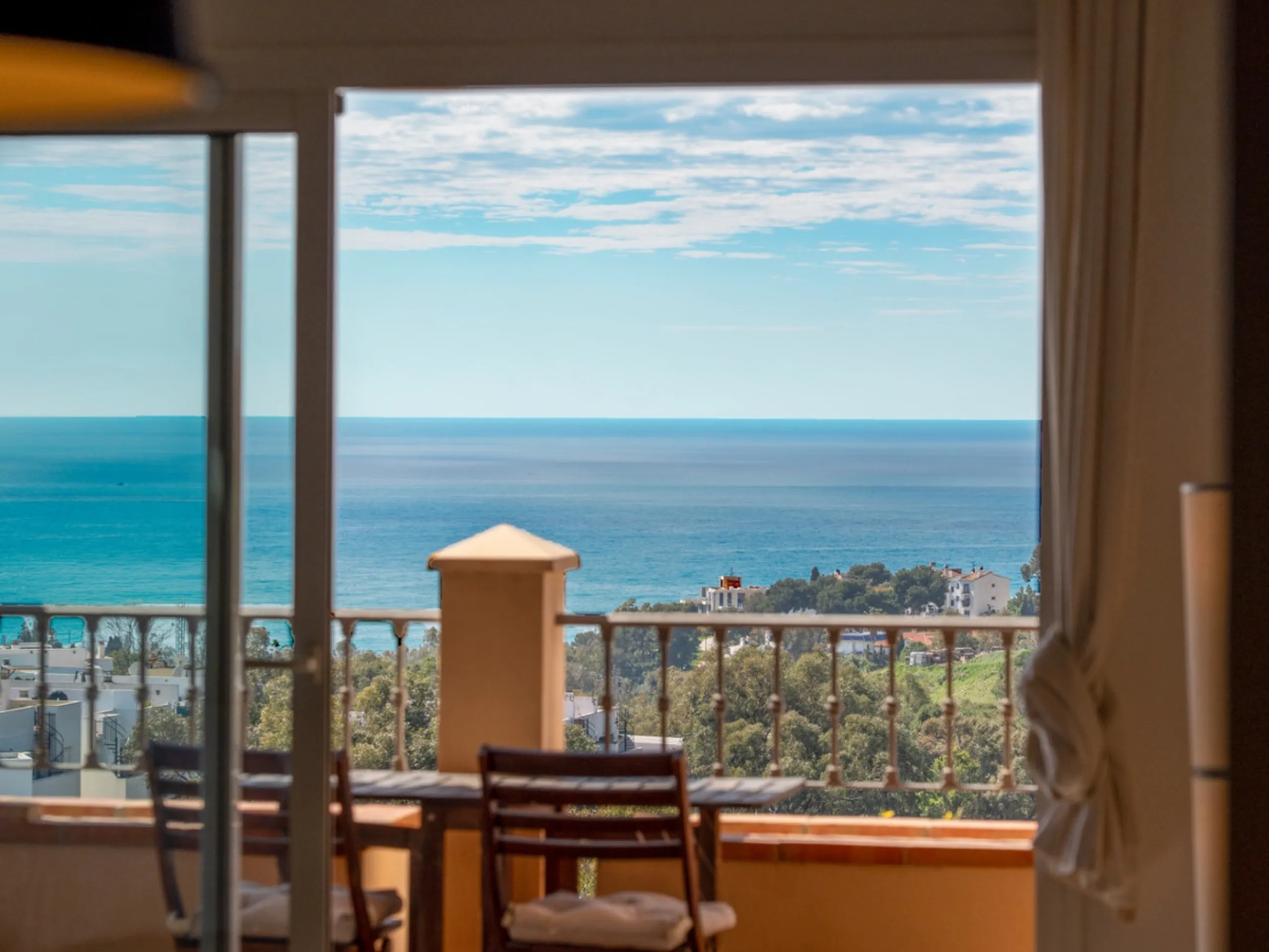 This penthouse is a 2 bedroom 2 bathroom duplex penthouse just 1 km from the beach. The home features open plan living spaces with bright interiors and large terrace windows. The kitchen overlooks the lounge and dining area through an elegant archway. The