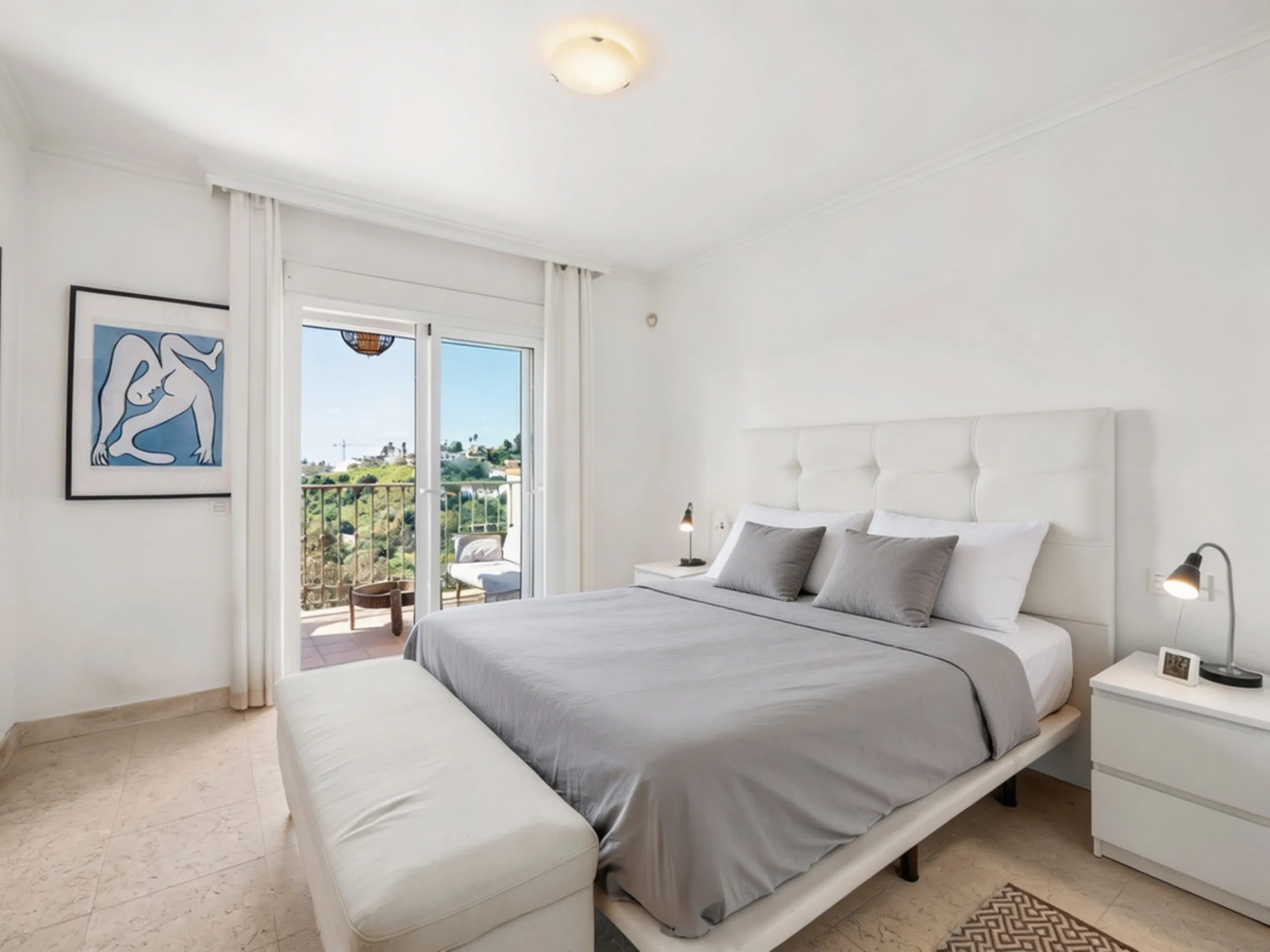 This penthouse is a 2 bedroom 2 bathroom duplex penthouse just 1 km from the beach. The home features open plan living spaces with bright interiors and large terrace windows. The kitchen overlooks the lounge and dining area through an elegant archway. The