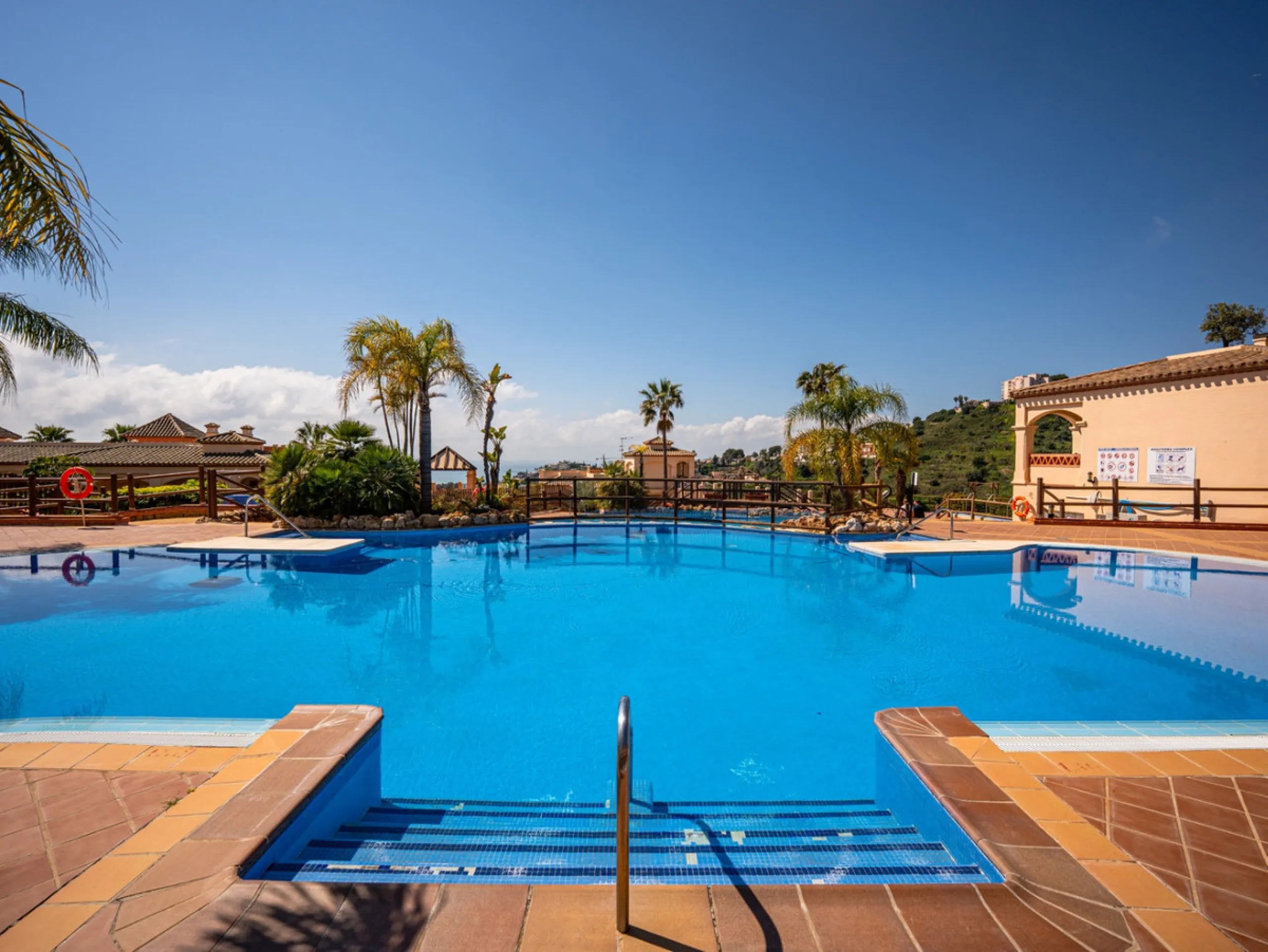 This penthouse is a 2 bedroom 2 bathroom duplex penthouse just 1 km from the beach. The home features open plan living spaces with bright interiors and large terrace windows. The kitchen overlooks the lounge and dining area through an elegant archway. The