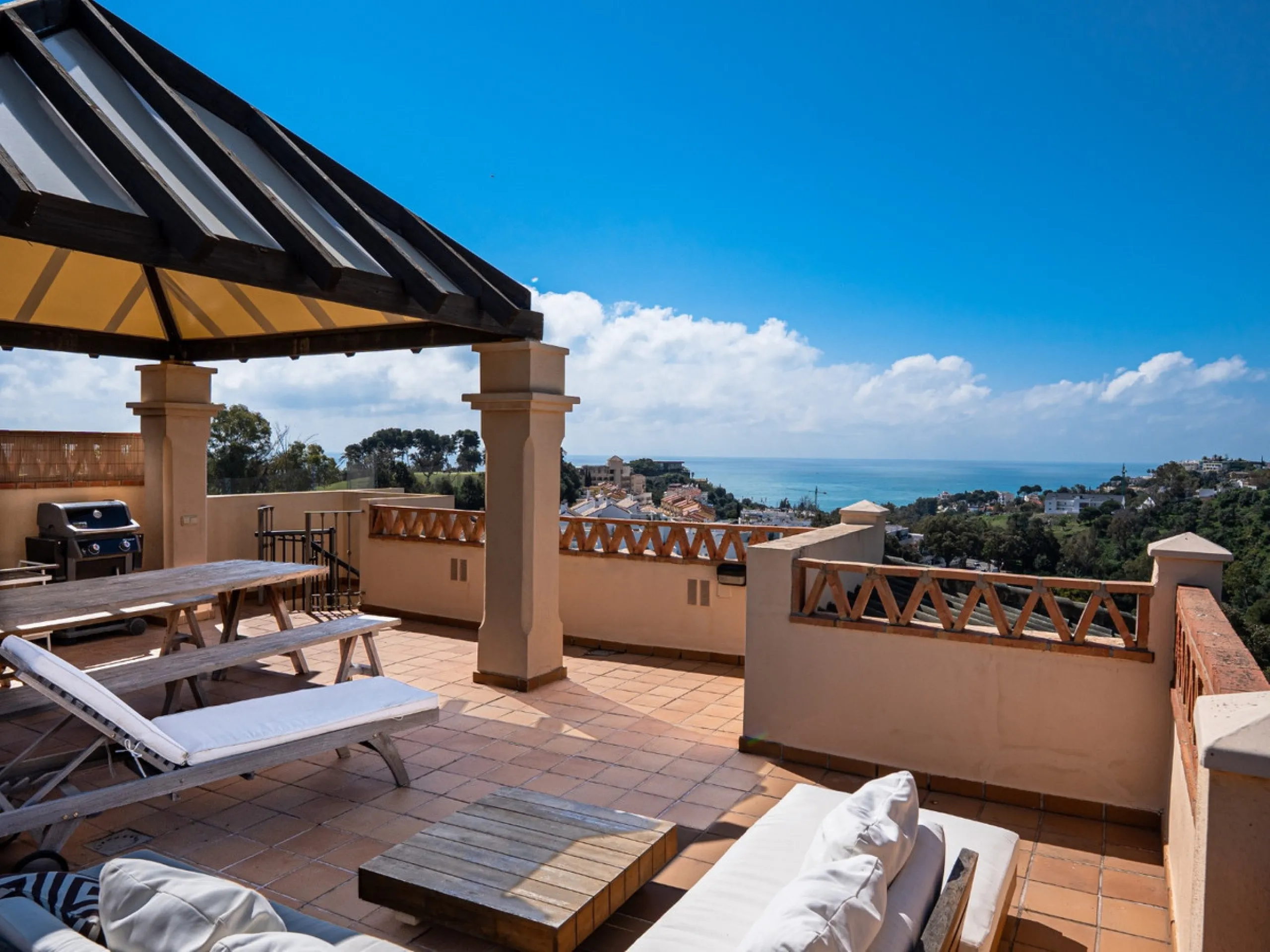 This penthouse is a 2 bedroom 2 bathroom duplex penthouse just 1 km from the beach. The home features open plan living spaces with bright interiors and large terrace windows. The kitchen overlooks the lounge and dining area through an elegant archway. The