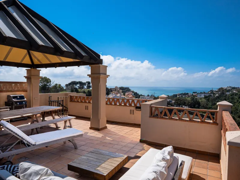 This penthouse is a 2 bedroom 2 bathroom duplex penthouse just 1 km from the beach. The home features open plan living spaces with bright interiors and large terrace windows. The kitchen overlooks the lounge and dining area through an elegant archway. The