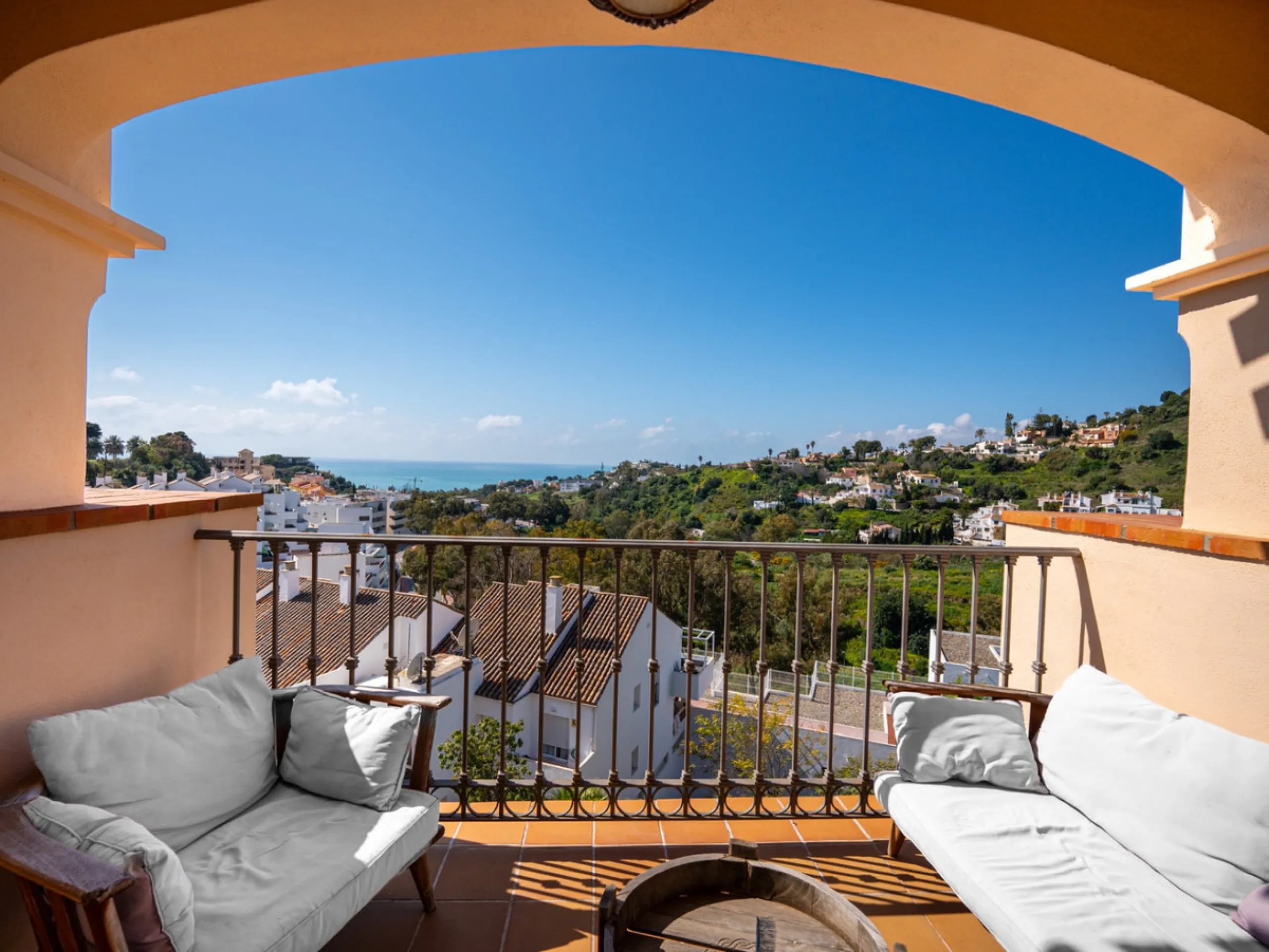 This penthouse is a 2 bedroom 2 bathroom duplex penthouse just 1 km from the beach. The home features open plan living spaces with bright interiors and large terrace windows. The kitchen overlooks the lounge and dining area through an elegant archway. The