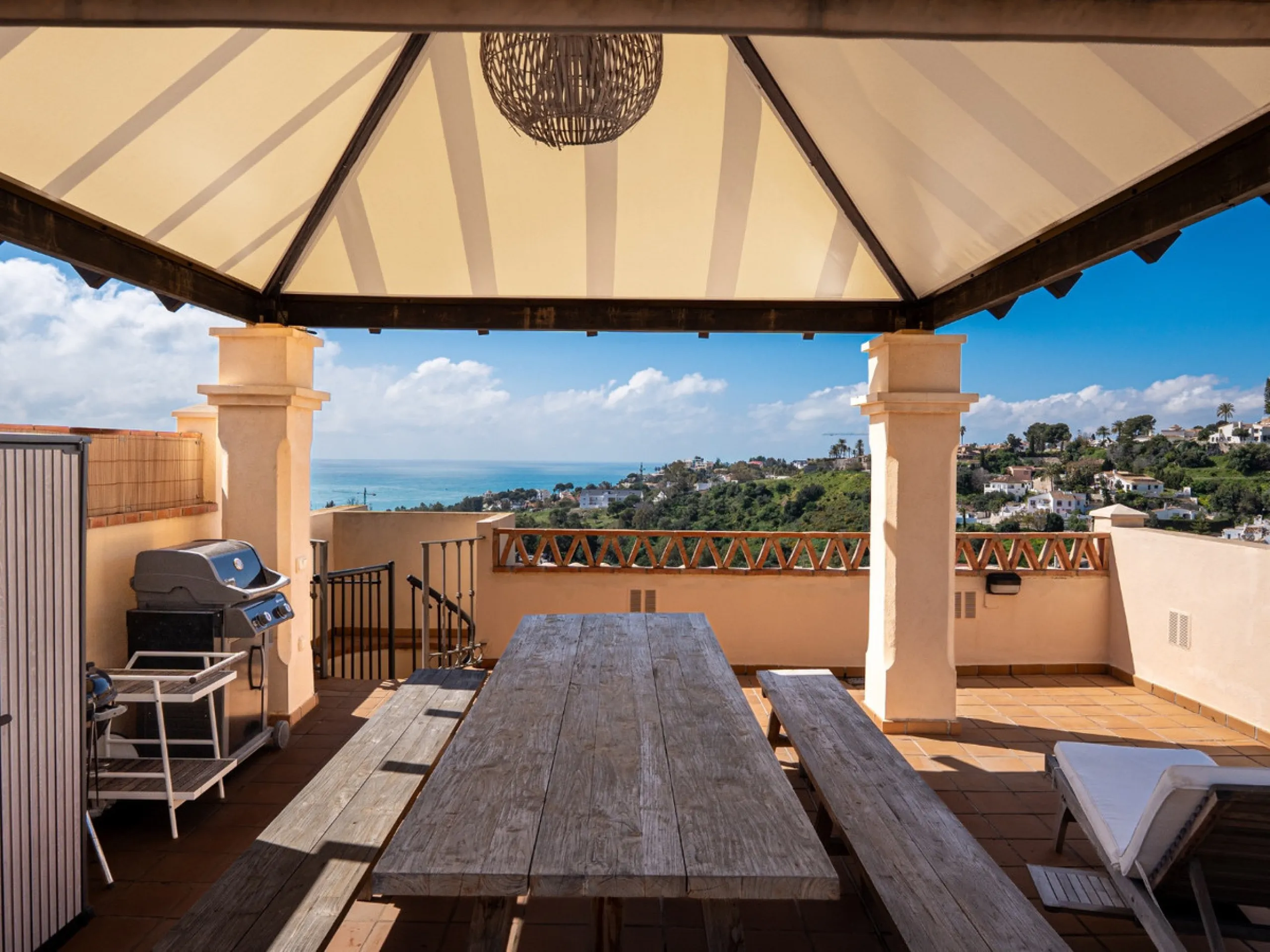 This penthouse is a 2 bedroom 2 bathroom duplex penthouse just 1 km from the beach. The home features open plan living spaces with bright interiors and large terrace windows. The kitchen overlooks the lounge and dining area through an elegant archway. The
