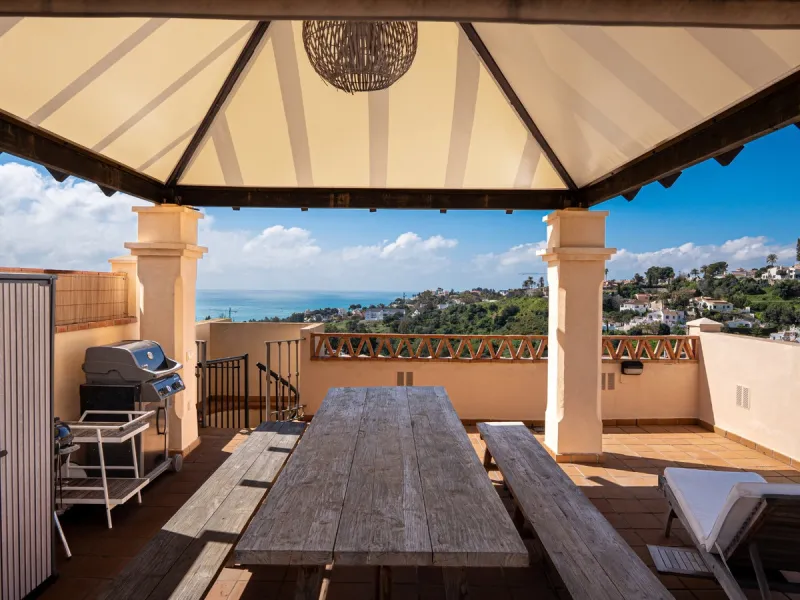 This penthouse is a 2 bedroom 2 bathroom duplex penthouse just 1 km from the beach. The home features open plan living spaces with bright interiors and large terrace windows. The kitchen overlooks the lounge and dining area through an elegant archway. The