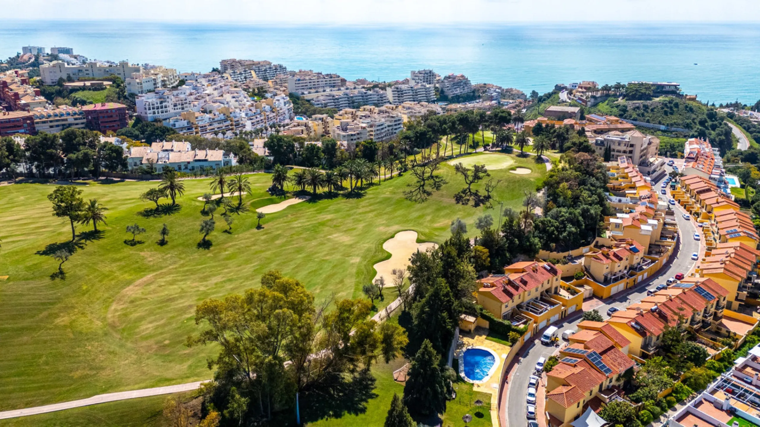 This penthouse is a 2 bedroom 2 bathroom duplex penthouse just 1 km from the beach. The home features open plan living spaces with bright interiors and large terrace windows. The kitchen overlooks the lounge and dining area through an elegant archway. The