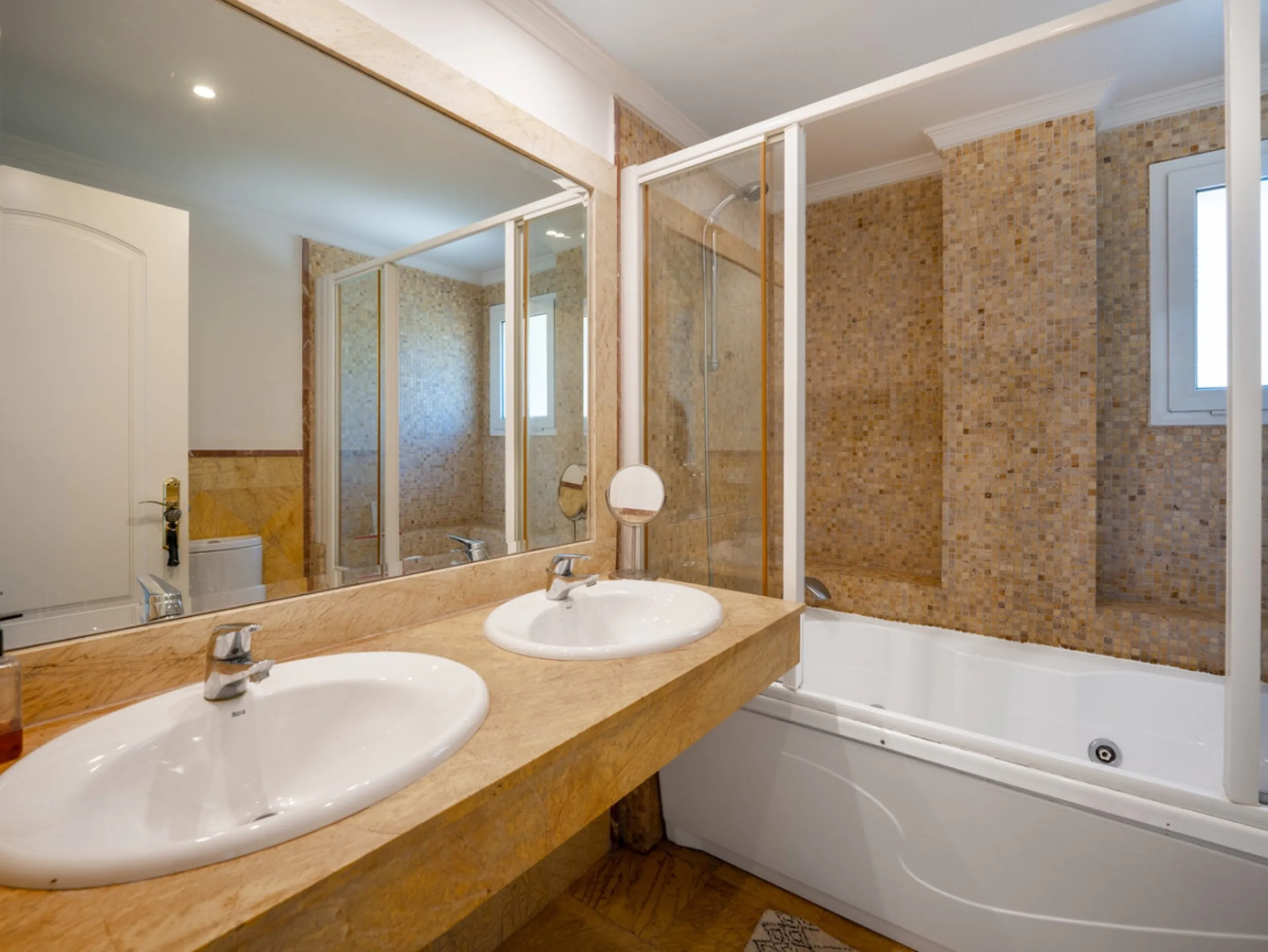 This penthouse is a 2 bedroom 2 bathroom duplex penthouse just 1 km from the beach. The home features open plan living spaces with bright interiors and large terrace windows. The kitchen overlooks the lounge and dining area through an elegant archway. The