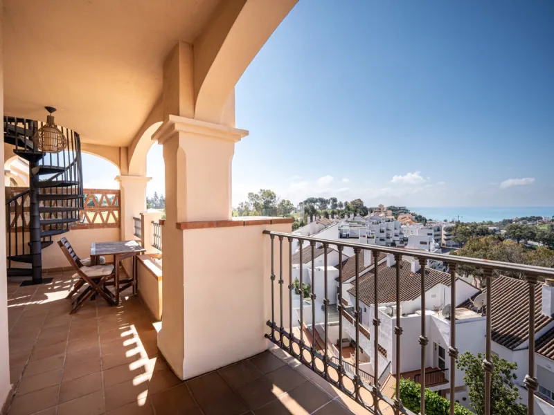 This penthouse is a 2 bedroom 2 bathroom duplex penthouse just 1 km from the beach. The home features open plan living spaces with bright interiors and large terrace windows. The kitchen overlooks the lounge and dining area through an elegant archway. The