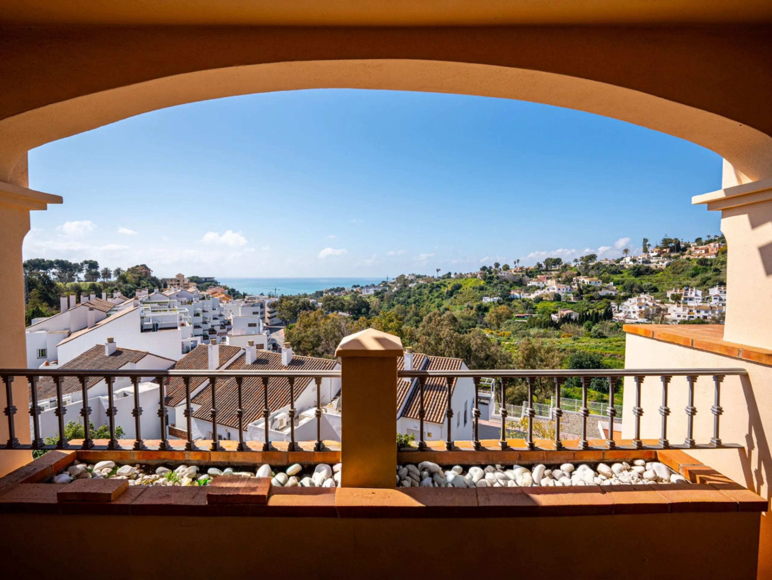 This penthouse is a 2 bedroom 2 bathroom duplex penthouse just 1 km from the beach. The home features open plan living spaces with bright interiors and large terrace windows. The kitchen overlooks the lounge and dining area through an elegant archway. The