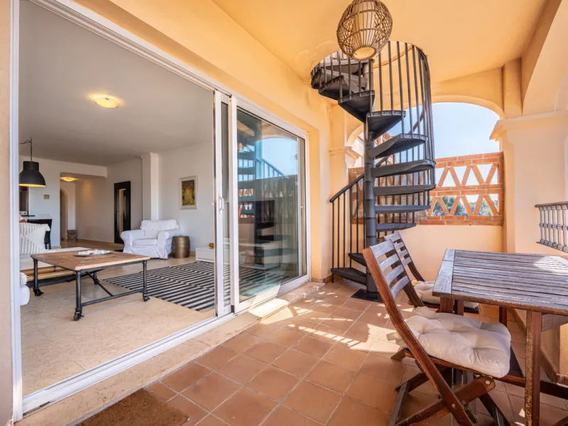 This penthouse is a 2 bedroom 2 bathroom duplex penthouse just 1 km from the beach. The home features open plan living spaces with bright interiors and large terrace windows. The kitchen overlooks the lounge and dining area through an elegant archway. The