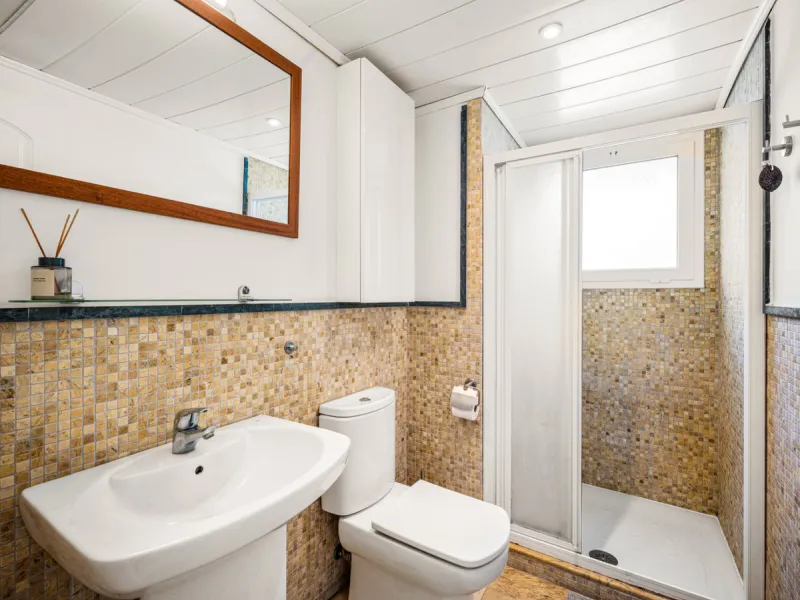 This penthouse is a 2 bedroom 2 bathroom duplex penthouse just 1 km from the beach. The home features open plan living spaces with bright interiors and large terrace windows. The kitchen overlooks the lounge and dining area through an elegant archway. The