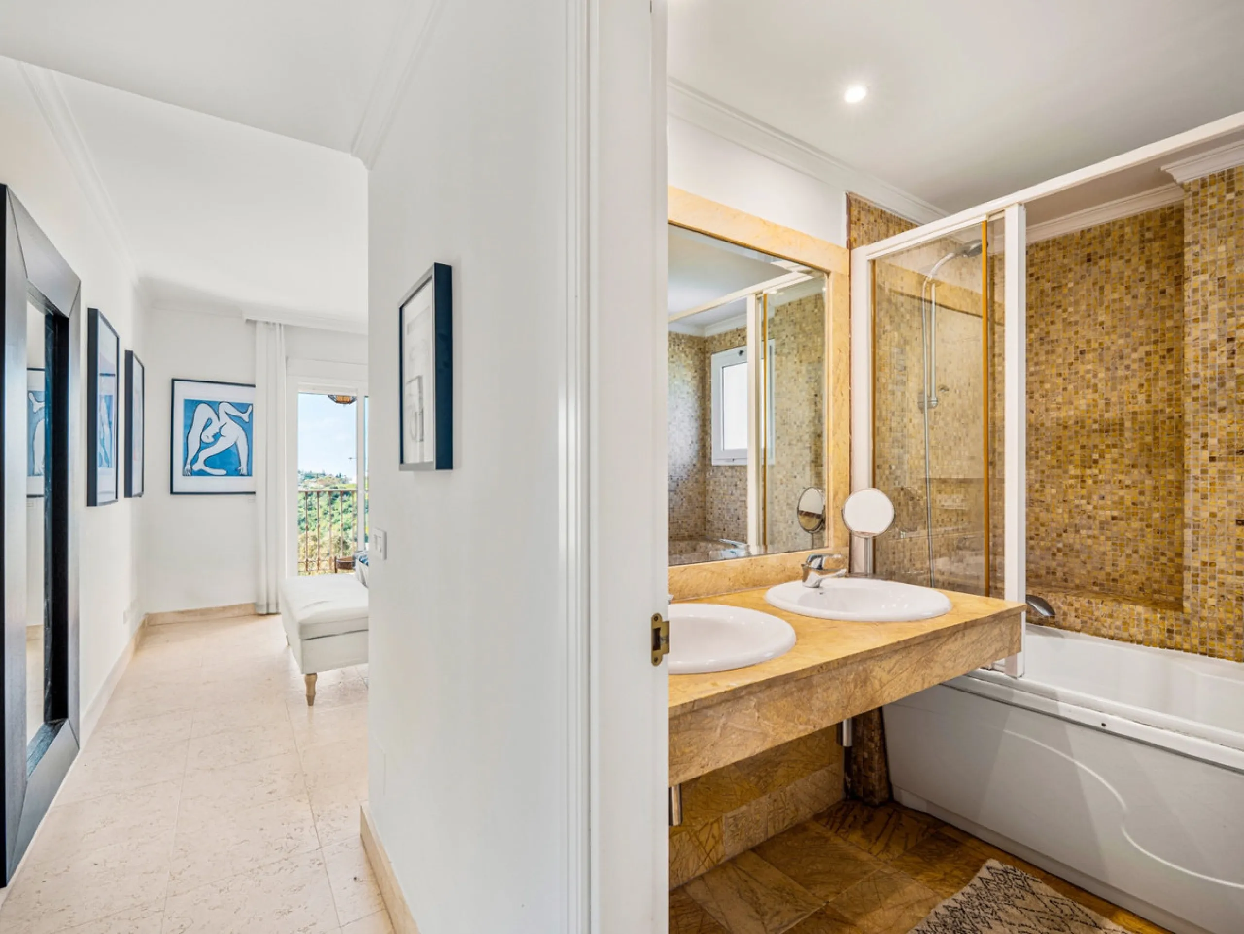This penthouse is a 2 bedroom 2 bathroom duplex penthouse just 1 km from the beach. The home features open plan living spaces with bright interiors and large terrace windows. The kitchen overlooks the lounge and dining area through an elegant archway. The
