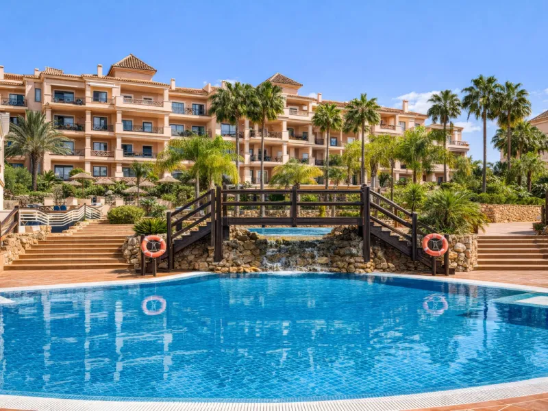 This penthouse is a 2 bedroom 2 bathroom duplex penthouse just 1 km from the beach. The home features open plan living spaces with bright interiors and large terrace windows. The kitchen overlooks the lounge and dining area through an elegant archway. The