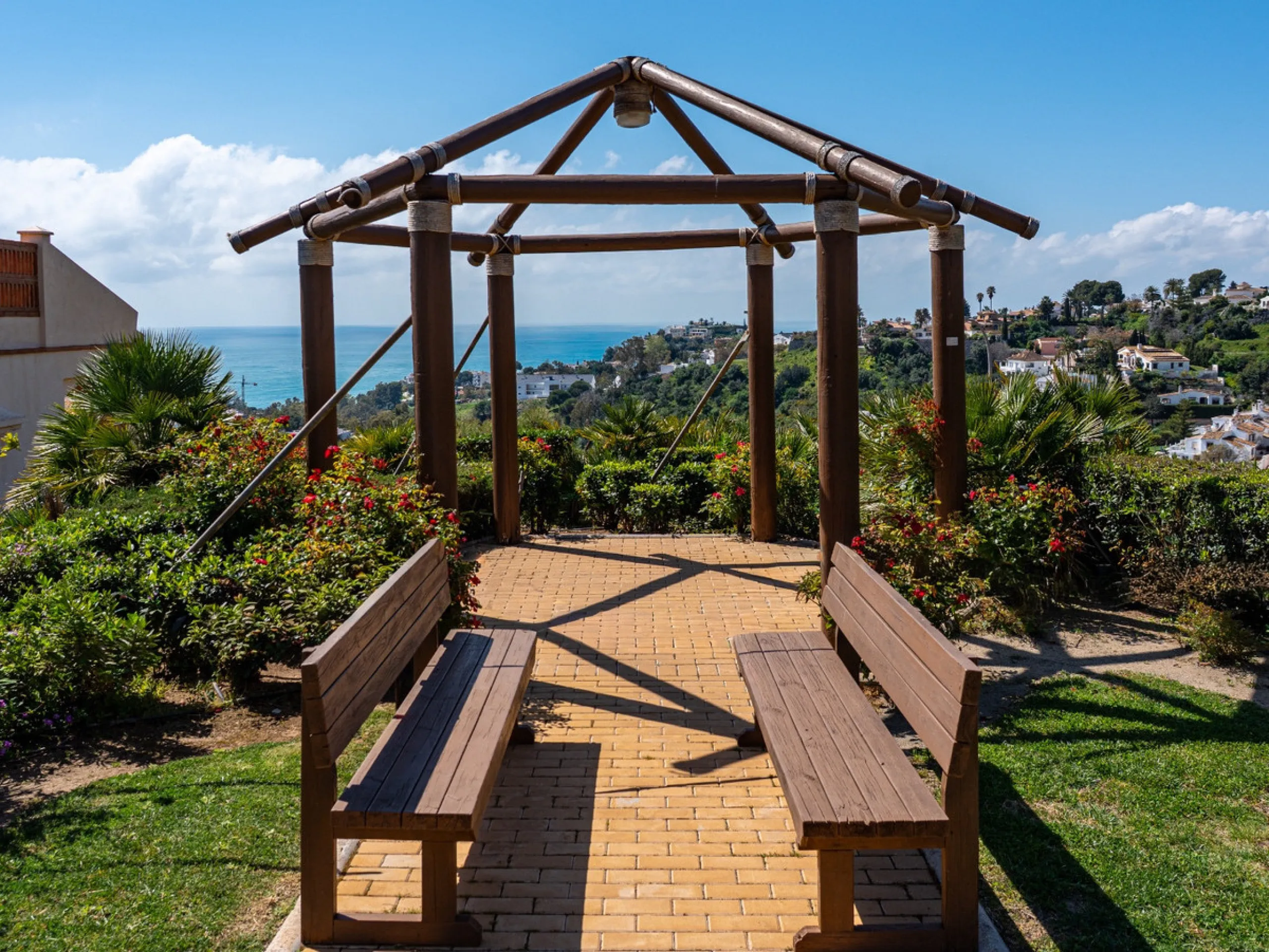 This penthouse is a 2 bedroom 2 bathroom duplex penthouse just 1 km from the beach. The home features open plan living spaces with bright interiors and large terrace windows. The kitchen overlooks the lounge and dining area through an elegant archway. The