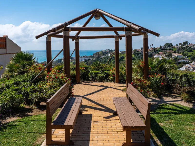 This penthouse is a 2 bedroom 2 bathroom duplex penthouse just 1 km from the beach. The home features open plan living spaces with bright interiors and large terrace windows. The kitchen overlooks the lounge and dining area through an elegant archway. The