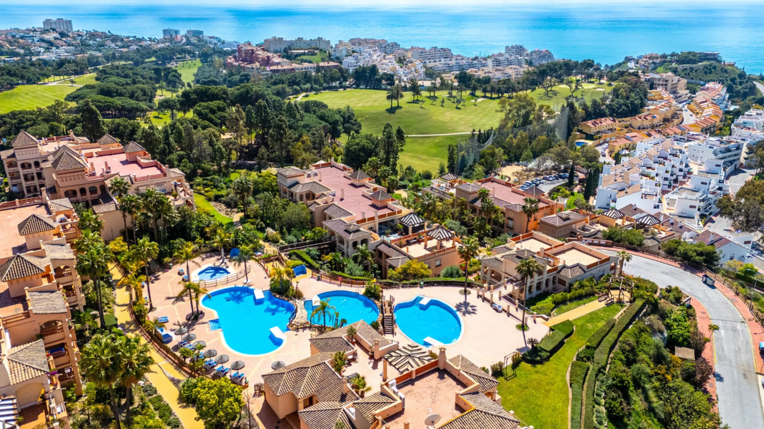 This penthouse is a 2 bedroom 2 bathroom duplex penthouse just 1 km from the beach. The home features open plan living spaces with bright interiors and large terrace windows. The kitchen overlooks the lounge and dining area through an elegant archway. The