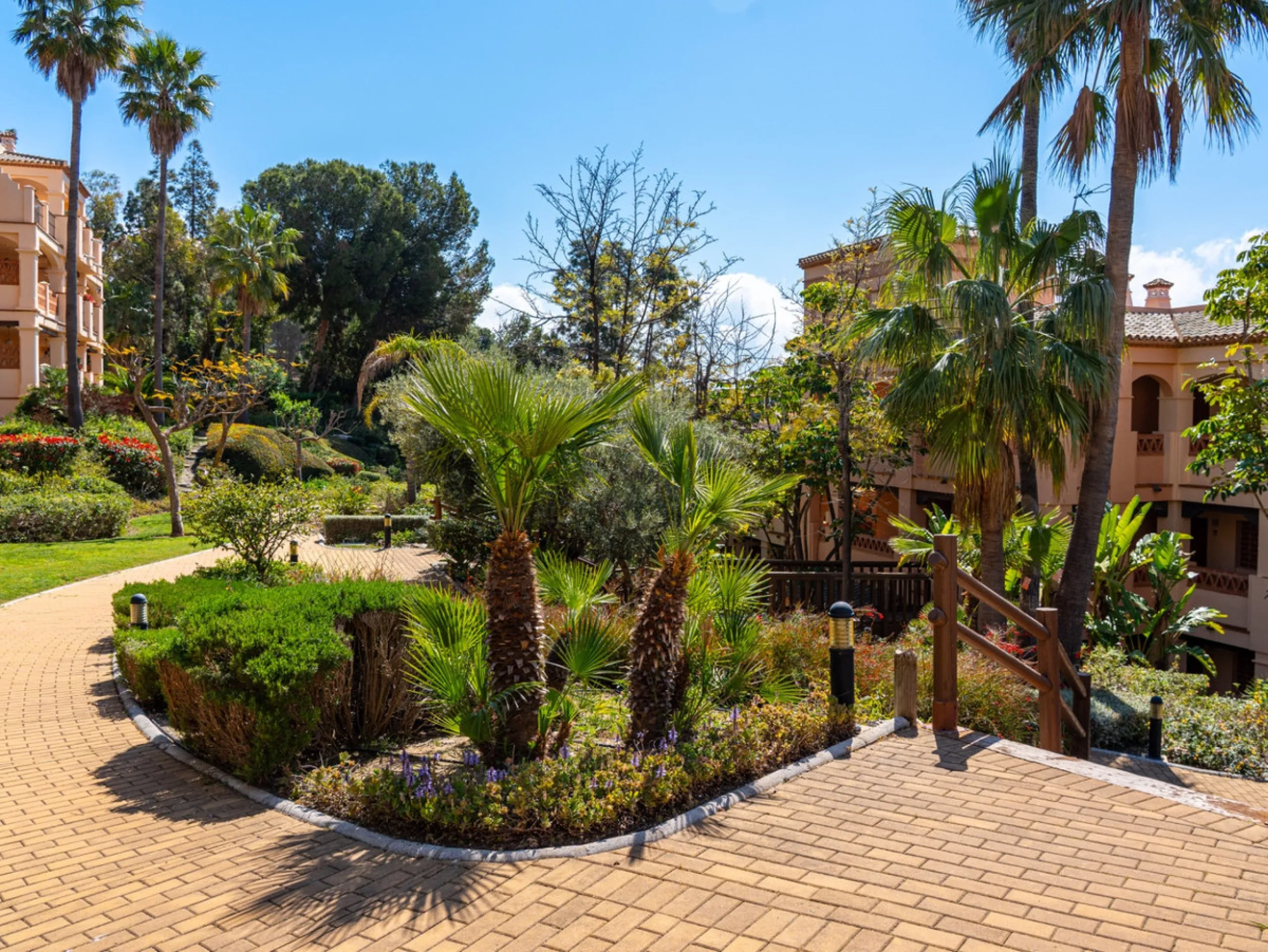 This penthouse is a 2 bedroom 2 bathroom duplex penthouse just 1 km from the beach. The home features open plan living spaces with bright interiors and large terrace windows. The kitchen overlooks the lounge and dining area through an elegant archway. The