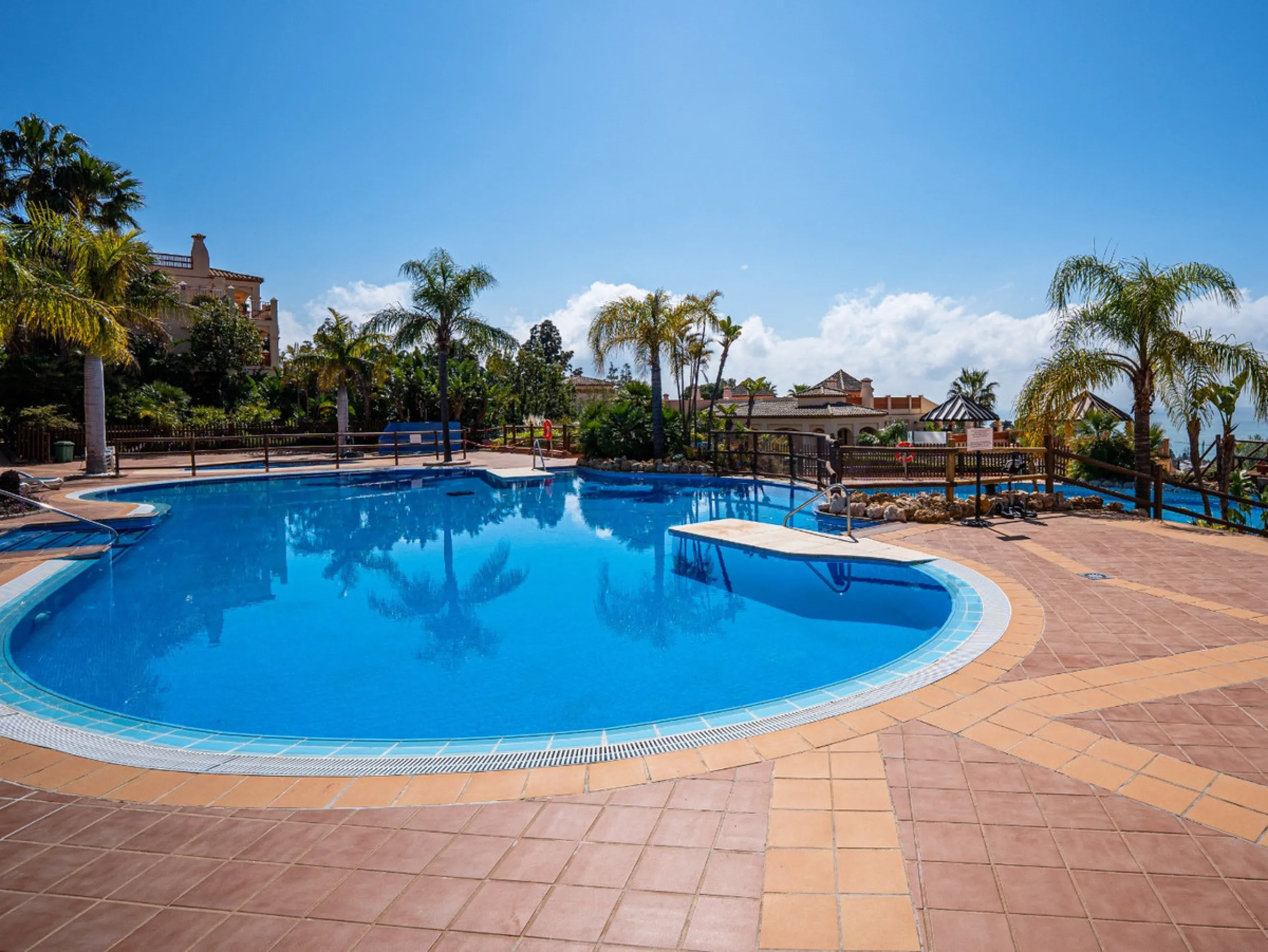 This penthouse is a 2 bedroom 2 bathroom duplex penthouse just 1 km from the beach. The home features open plan living spaces with bright interiors and large terrace windows. The kitchen overlooks the lounge and dining area through an elegant archway. The